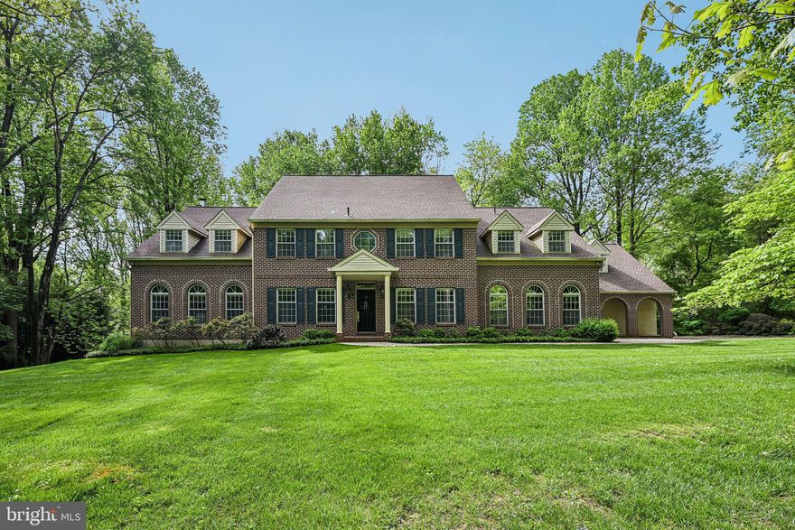 Strategically repositioned to deliver exceptional value in today’s luxury market, this pre-inspected and extensively refreshed estate offers a rare combination of privacy, transparency, significant recent improvements, and move-in-ready living.

Experience the tranquility of a magnificent estate setting while remaining connected to everything the region has to offer. Set on 8.67 acres within an exclusive enclave of seven executive estates, 2 Bittersweet Drive is surrounded by 73 acres of conservancy land, offering extraordinary privacy, natural beauty, and serenity.

Ideally located near West Chester, Longwood Gardens, King of Prussia, the Main Line, Philadelphia, and Wilmington, the property offers the perfect balance of retreat and accessibility. Residents enjoy proximity to the highly regarded Unionville-Chadds Ford School District, premier independent schools, universities, shopping, dining, and major commuter routes.

Custom-built by DeLuca Homes with superior 2x12 construction, this elegant brick-front colonial recently underwent a six-figure refresh and is truly move-in ready. Significant improvements include two new HVAC systems, a new lifetime roof, updated electrical systems, a recently installed hot water heater, and a whole-house Caterpillar generator supported by a 1,000-gallon propane tank.

For additional peace of mind, the property has been pre-inspected by Arms Home Inspections. Licensed and insured professionals have addressed recommended items, with supporting documentation available for buyer review.

A gracious foyer with a sweeping staircase introduces interiors designed for both refined living and effortless entertaining. Formal living and dining rooms flow seamlessly into the inviting great room with a fireplace, while expansive windows frame picturesque views throughout the home.

A standout feature is the exceptional four-season room, thoughtfully designed to bring the outdoors in year-round. Appointments include solar-powered skylights, a sink, a cast-iron heater, and direct access to the Trex deck with a retractable awning.

The gourmet kitchen is appointed with a Wolf cooktop, Sub-Zero refrigerator drawers, abundant workspace, and a large walk-in pantry. The main level also offers flexible suite-style spaces ideal for dual home offices, guest accommodations, multigenerational living, or accessibility needs, complemented by a spacious full bath.

The second floor features an expansive primary suite complete with a private lounge, two walk-in closets, an additional accessory closet, and a spa-inspired bath. Additional accommodations include a generous en-suite bedroom with a walk-in closet, a third spacious bedroom with dual closets, and a finished bonus room with a walk-in closet ideal for use as an additional bedroom, gym, playroom, studio, or media space. An unfinished flex room offers additional opportunity for customization.

Designed for recreation and entertaining, the finished lower level features rich cedar paneling, a built-in bar, and dedicated spaces for billiards, darts, games, and gatherings.

2 Bittersweet Drive presents a rare opportunity to own a beautifully refreshed and meticulously prepared estate property in one of Chester County’s most desirable settings.

Please contact the listing agent to schedule a private tour or request additional information.