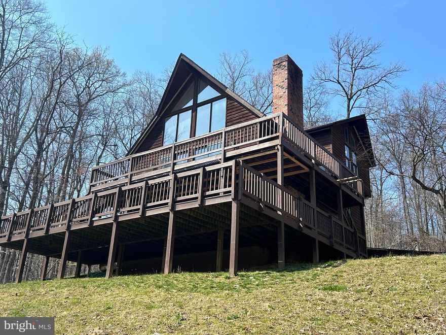Sunshine streams through oversized windows and skylights at this stunning A-frame, perched above the flood plain yet only a short distance from the river's edge where you can enjoy river access. A recently expanded kitchen creates a perfect breakfast nook with nature views. High ceilings offer plenty of head-room and ample space for ceiling fans. The lower level has extra room for entertaining, a full bath, plus a laundry and mechanical room. Steamboat Run is ideally located less than 10 minutes from Shepherdstown, Shepherd University, and the National Conservation Training Center. Nearly 29 acres of shared riverfront - a rare amenity - provides homeowners with water access for kayaking, swimming, and fishing, and plenty of space for walking, biking, and birdwatching.