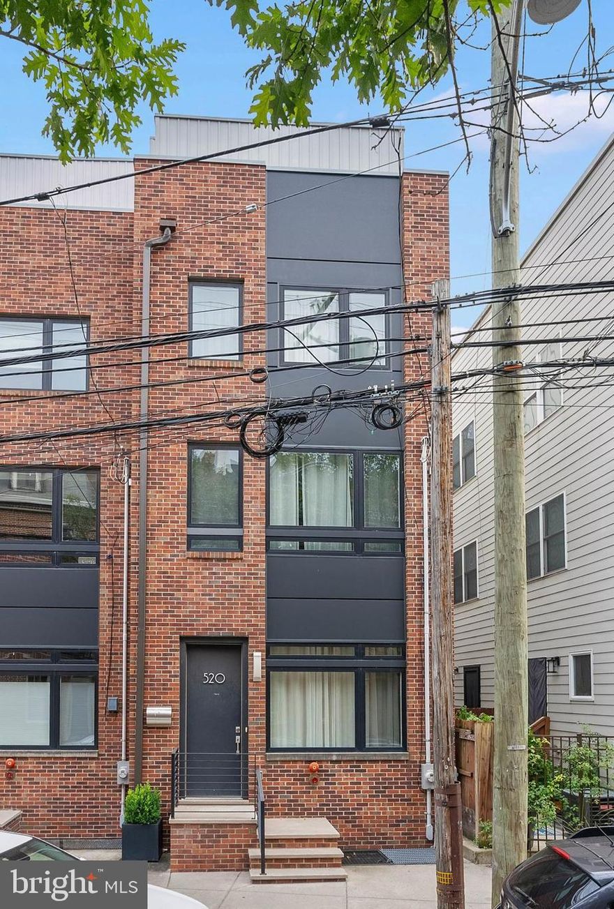 Stunning 3 bedroom, 3.5 bathroom home in the heart of Northern Liberties, offering garage parking, incredible ceiling height, and a spacious roof deck with city views. This thoughtfully designed residence is flooded with natural light thanks to oversized windows throughout, and features beautiful hardwood floors and recessed lighting. The open-concept kitchen is a showstopper with sleek quartz countertops, stainless steel appliances, ample cabinet space, and modern designer fixtures. Each of the three bathrooms is finished with elegant tile work and upscale finishes, including the spa-like primary ensuite, which features a double floating vanity, glass-enclosed shower, and premium tile design. Occupying its own floor, the primary suite is a true retreat, complete with generous closet space and a large, light-filled bedroom. Two additional bedrooms offer great space and storage, making this home as functional as it is beautiful. Located just steps from Liberty Lands Park and some of the neighborhood’s best restaurants and cafes, this home blends luxury living with one of Philly’s most vibrant communities. Buyer is responsible to verify taxes and square footage independently. *Interior photos are of a similar home.