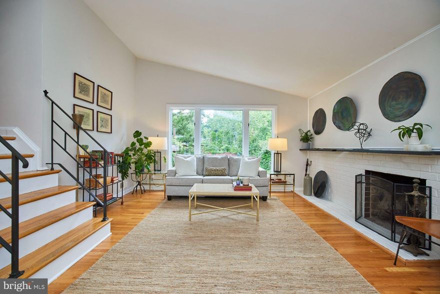 Tastefully renovated 3BR / 2.5 Bath mid-century home located on a quiet cul-de-sac, near the Holmes Run Trail, in the heart of the Brookville Seminary Valley neighborhood. You will be wowed when you walk through the front door to the light-filled large living room with hardwood floors, high ceilings, and plenty of wall space for art. Enjoy the view of your beautiful backyard through the enormous upgraded Anderson pine casing double pane windows. The beautifully renovated chef's kitchen, which serves as the hallmark of the home is perfect for social gatherings or cooking elaborate meals. The kitchen has everything a chef could need including a six-burner, dual fuel range and Viking range hood, Viking wine fridge, Bosch dual compressor refrigerator, built-in microwave, pot filler, and deep stainless sink. The hand-crafted island has a Carrera marble top and offers plenty of storage below. The butcher block countertops contrast nicely with the island, both of which serve as perfect meal prep spaces. The adjacent dining area has built-in storage seating which can accommodate a long dining table for large gatherings or just simple family dinners. Just off of the kitchen is a private patio with a granite-topped bar area that opens up to a serene backyard with a water feature, a custom fire pit, and a variety of seating areas.  Serve outdoor meals from the Weber grill (conveys as-is), relax on hand-crafted seating including both live edge and floating benches, or simply enjoy the lush but low maintenance curated landscaping with flagstone paths throughout. Mature hostas, ferns, azaleas, peonies, ornamental grasses, Japanese Lantern plants, and more set this home apart from any other. The outdoor storage shed is an added plus as it provides enough storage for all of your outdoor tools.  All of the spa-like renovated bathrooms have been completely renovated and include ultra-low flow toilets, LED lights, new vanities, fixtures, and beautiful tile.  All electrical outlets have been upgraded and home electronics will be protected by a whole-home surge protector. This "smart" home utilizes a variety of connected devices including smart door locks, switches, smoke and carbon monoxide detectors, and a Ring alarm system. All of these devices can also be used disconnected from the network. Other updates include a NEW Rheem furnace (installed 2022 with a warranty that conveys), a reverse osmosis water purifier, and new lighting throughout. Conveniently access the Holmes Run Trail for cycling/walking paths that lead to the Fox Chase shopping center, Cameron Run, and points beyond. Quickly access I-395, the Van Dorn Metro, D.C, and Old Town Alexandria. A true commuters dream!