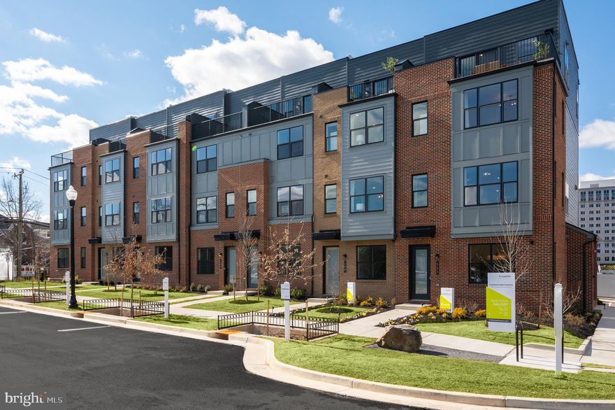 Entertaining is made easy with the bright and open main living level that features a large great room, spacious dining room, and upgraded kitchen that opens to the outdoor living. The stylish kitchen is complete with Calacatta Gold quartz countertops, Fog cabinets, oversized island, and KitchenAid stainless steel appliances. Upstairs you’ll find an impressive primary suite with a huge walk-in closet, and a spa-like primary bath with Zeus White quartz countertops and oversized shower. The second floor also has a secondary bedroom with a large walk-in closet and an additional full bath. The third floor offers an additional bedroom, full bath and a light-filled loft that opens to the rooftop terrace. The lower level has a sizeable flex room.