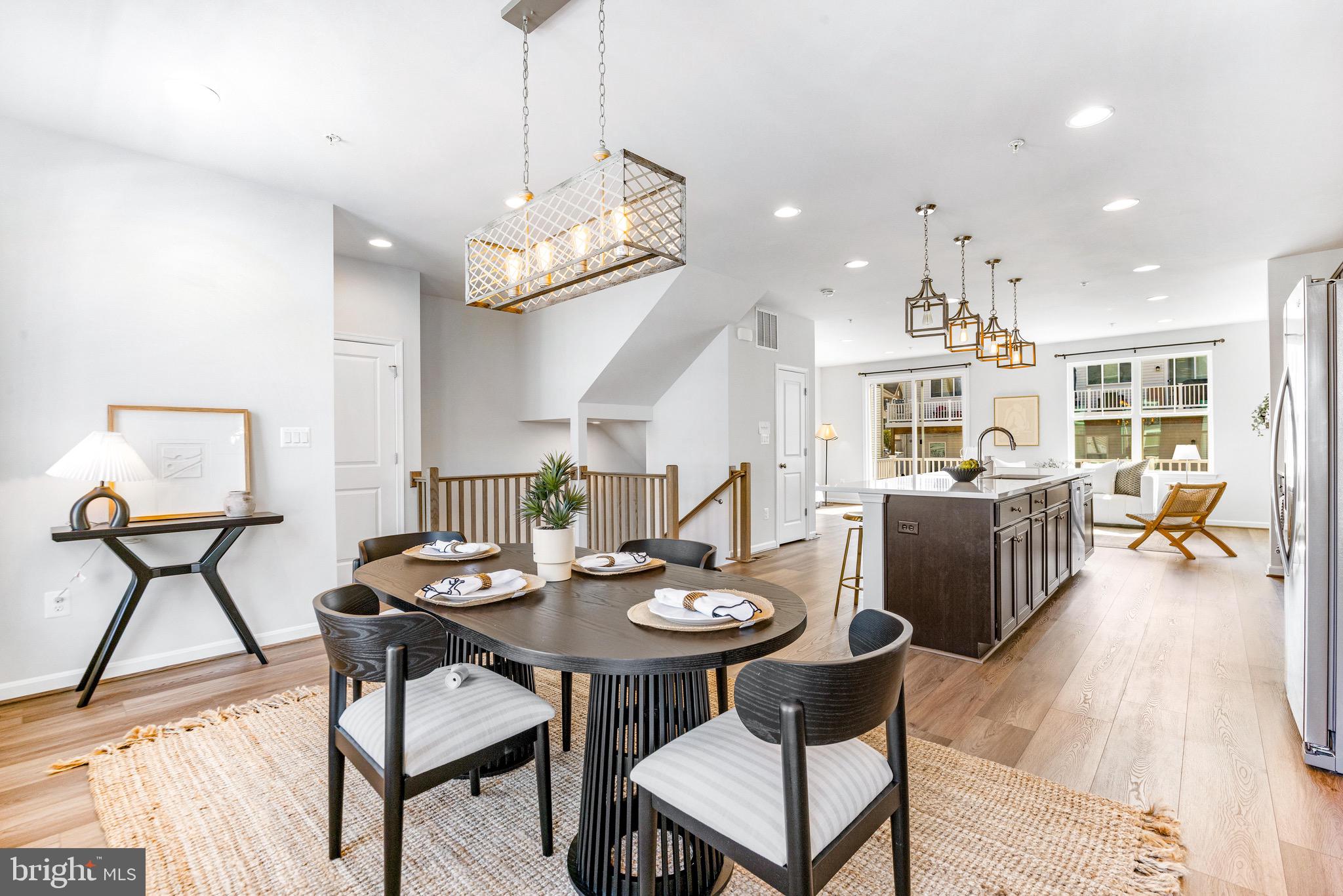 Largest & widest model in the community! Like-new, and truly lives like a single-family with large-scale spaces and checks ALL the boxes. Enjoy the actual 2-CAR GARAGE, fenced yard, deck, spare bedrooms that definitely fit queen beds and furniture, dining area that comfortably seats eight, walk-in closet, hardwood floors and steps, cozy fireplace, huge kitchen, and more, in this 3.5-year-old beauty. Peaceful, quiet setting with an unbeatably convenient location: Sitting on your deck, you'll immediately forget you are less than 3 minutes from 97, and less than 20min to Ft. Meade, BWI, the MARC train, or a Ravens game downtown, and only 25 minutes to Annapolis! Watsons Glen has a gazebo, walking paths, playground, and HOA-maintained landscaping.
