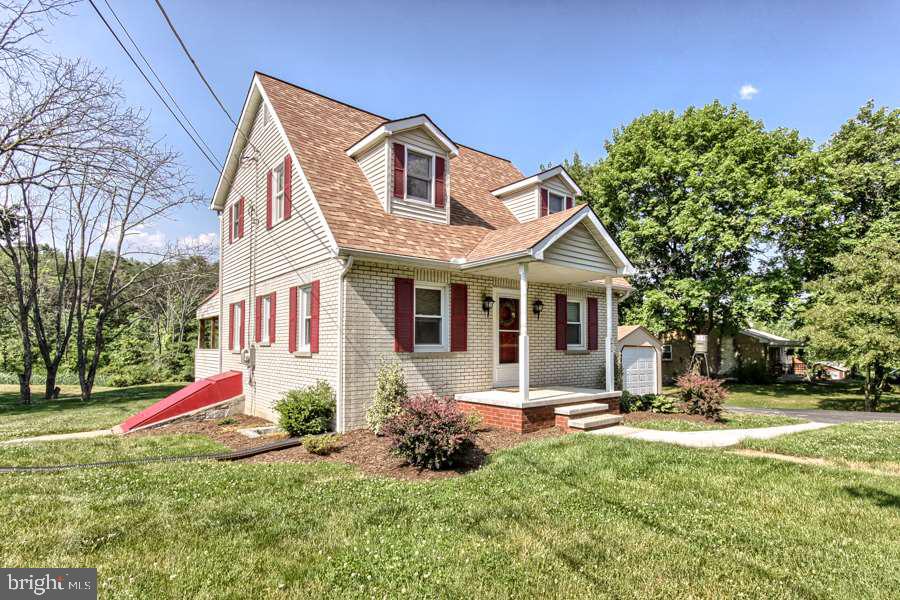 Beautiful 3 Bedroom Cape Cod-lovely low maintenance hard wood floors. 2 Full bathrooms, mature landscaping, large rear covered porch for entertaining and spacious 1.39 acres with wooded back drop. Newer roof and septic. No worries! This gem is hard to find and wont last long in Cumberland Valley School district, Brick and siding, freshly painted- low maintenance home! Optional heat source-wood boiler can heat entire house for extremely low operating costs. Must see to appreciate!!