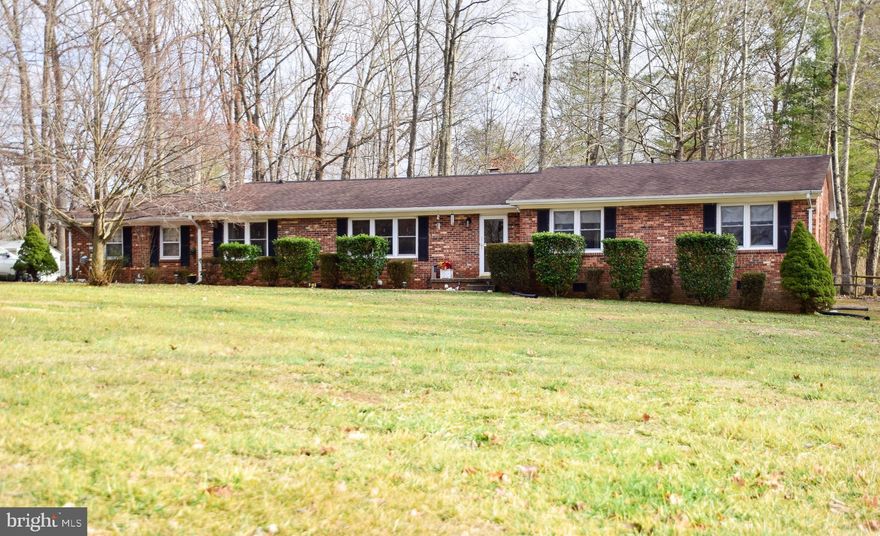 This beautiful home lives up to its street name!  3 BR, 2BA All-Brick Rambler on PEACEFUL Ct.  If you re looking for a quiet setting, don t miss this well-maintained home in an unbelievably peaceful setting.  It is tucked away in The Estates subdivision, toward the end of the cul-de-sac!   Upon entering through the front door, you will find the living areas to the left and the bedrooms to the right.   The living room opens into the dining area, creating an open space for entertaining.  Notice the attention to detail with the arched doorways.   On the back side of the house are the family room, which has a wood-burning insert, and a great updated kitchen with many upgrades, including Corian counter tops, soft-close drawers, Bosch dishwasher, stove, and cooktop.  You can also exit through the laundry area to the 1 1/2-car garage or to the nice, large, flat back yard, perfect for entertaining, gardening, and child's play!   On the other end of the house are the master bedroom with walk-in closet and adjacent ensuite.  2 additional bedrooms and a full hall bath complete this lovely home.  Pride in ownership is evident throughout!  The owners have upgraded to vinyl windows and installed hardwood & laminate floors in all but the master and one other bedroom.  The crawl space was just recently encapsulated.  The HVAC compressor was replaced in 2019.  This home is just minutes from I-95, shopping, commuter options, and the back gate of Quantico.  Margaret Brent Elementary,  Andrew G. Wright Middle, Mountain View High School.  Don t miss the opportunity for one-level living in a prime, PEACEFUL, location!  Schedule your showing TODAY!!!