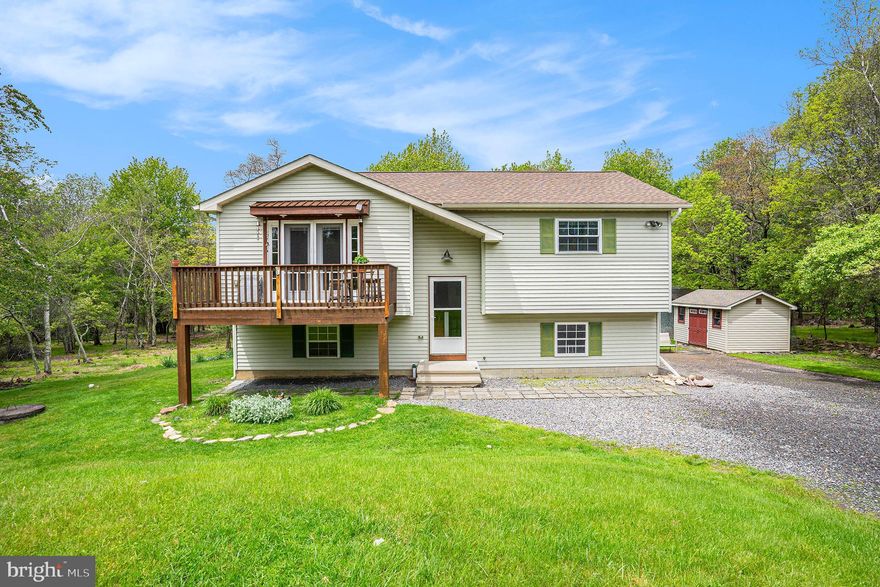 13 Denise Ct – Your Private Poconos Retreat
Welcome to Valley View Estates, one of the Poconos’ most serene and sought-after communities, where extra-wide roads, lush woodlands, and generous lot sizes offer privacy, peace, and beauty in every direction.
Tucked away on a tranquil cul-de-sac, this beautifully maintained home sits on a stunning 2-acre lot surrounded by mature trees and expansive open lawn—your own private oasis with endless potential.
Step inside to a light-filled, open-concept ,main living space where oversized windows bring the outdoors in. The spacious living area flows seamlessly into a welcoming kitchen and cozy dining nook, making it perfect for entertaining or everyday living. Don’t forget to hang out on the front porch in the morning, on upper level where you are sure to see tons of wildlife  wandering.
Down the main hallway, you'll find a full bath, a bright guest bedroom, and a serene primary suite—all offering comfort and warmth with plenty of natural light.
The fully finished lower level is a showstopper—featuring radiant heated floors throughout, a massive entertainment area,  gleaming in sunlight, and limitless potential for a game room, movie lounge, or multi-functional living space. Two additional large bedrooms, a half bath, and laundry room are thoughtfully located on this level, along with walkout access to the backyard.
Step outside to enjoy your sprawling yard—ideal for gatherings, gardening, or simply relaxing among the trees. Two roomy sheds offer great storage for lawn equipment or recreational gear.
Whether you’re seeking a year-round residence or a mountain getaway, 13 Denise Ct delivers the perfect mix of privacy, space, and comfort—with nature right at your doorstep.