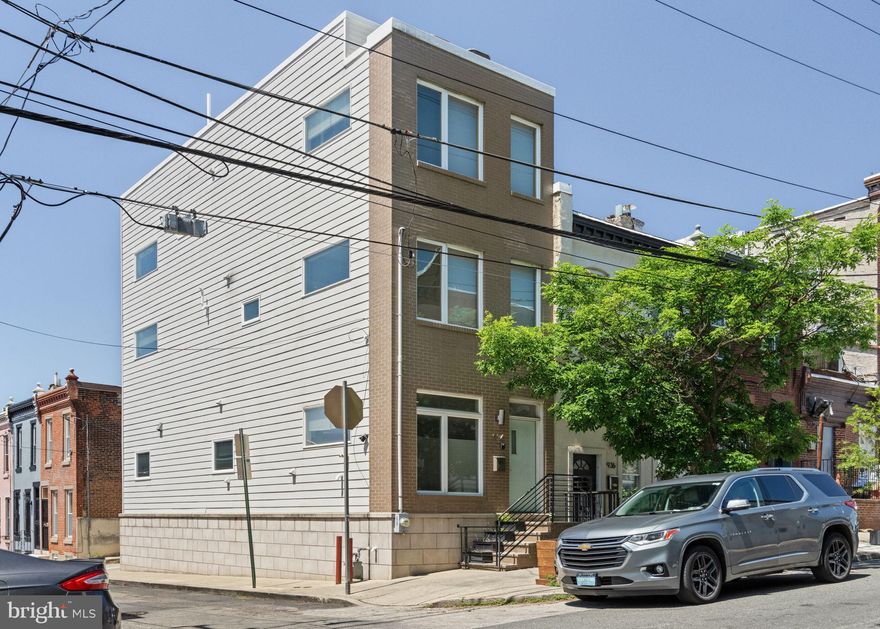 Introducing a stunning contemporary corner townhouse in the extremely popular neighborhood of Fairmount. This home boasts 3 spacious bedrooms, 2 full baths, 2 half baths, a private rear patio, and an incredible rooftop deck offering sweeping views of the Philadelphia skyline.

Step inside to discover richly stained 5" wide plank hickory floors that seamlessly flow throughout the living spaces, complemented by recessed lighting that bathes the home in warmth and charm. 

The heart of the home is the gourmet kitchen—a true masterpiece designed for cooking and entertaining. It boasts a sleek breakfast bar, Samsung stainless steel appliances, a 30" range hood, classic white Wolf Shaker-style cabinets, Tierra Bianco granite countertops, a striking glass tile backsplash, and a Delta TRINSINIC pull-down faucet. Eye-catching Kichler pendant lighting, a built-in wine rack, and a pantry/closet complete this chef's dream. Additionally, a powder room adds convenience to the well-thought-out floor plan.

The 2nd floor features 2 large bedrooms, hallway closet, and guest bath. The primary bedroom is a true oasis with a walk-in closet, storage closet, and a large primary ensuite bathroom.

Before entering the roof deck, enjoy and lounge in the sitting area with a beautiful wet bar featuring a mini fridge, prep sink, and granite countertop. The view from this room will really wow you! 

The private roof deck provides the ultimate outdoor escape, perfect for relaxing or hosting guests as you admire the stunning city views! You'll also appreciate the fully finished basement, which offers additional space for an additional bedroom or office space. Or exit out to the back patio for your outside adventures. 

This exceptional property blends modern elegance and thoughtful design and is located in a prime location in Fairmount. Situated just minutes from prime Philadelphia destinations like Fairmount Park, Boathouse Row, the Philadelphia Zoo & the Art Museum and just a short walk or commute to center city and to 76.

Please note: Current owner uses rear space behind the house to park a car in a non-conforming space. Parking is not legal parking. There is the space and curb cut in the rear of property for rear parking. Legal parking would require a variance.