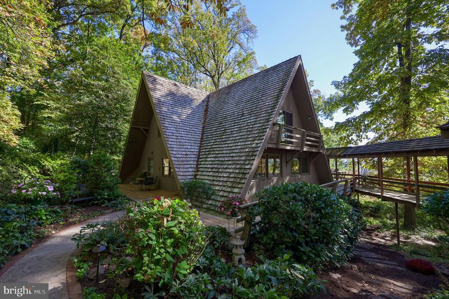 A unique Lancaster County setting makes this home stand out above
the rest! This double A-Frame beauty is a four-bedroom, two-and-a-half
bath oasis with a wraparound deck and two fireplaces, making it the
perfect daily retreat.
Set on a hillside with seven acres, the views of the valley below are
stunning! Nestled in the woods, surrounded by intricate gardens
and wildlife, this home is a sanctuary like no other in the area.
Amenities include geothermal heat, central vac, heated floors, reverse
osmosis water treatment, and a backup generator and a home warranty included!

Located in the East Hempfield school district, close to routes 30 and
283, near medical centers and shopping, this property is a must-see!