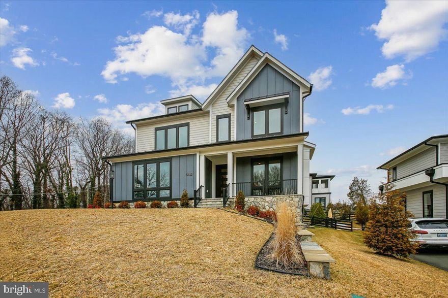 Modern sophistication meets exceptional convenience with effortless access to Downtown DC, the Pentagon, Tysons, Reagan National, and Dulles International. This extraordinary residence delivers the ultimate luxury lifestyle within a newly established enclave of high‑end homes—where thoughtful design, premium finishes, and modern efficiency come together seamlessly.
Constructed with the latest energy‑efficient materials, this home impresses from the moment you step inside. European French Oak flooring, high‑performance windows, and top‑of‑the‑line Café̃ appliances anchor the home’s sleek, modern aesthetic. Offering three fully finished levels, six bedrooms, seven full bathrooms, and two half baths, the residence features soaring 10‑foot ceilings on all levels and a sun‑drenched open floor plan that feels both expansive and refined.
A Kitchen designed to be the heart of the home. The chef’s kitchen is a true showpiece, anchored by an exceptionally expansive quartz island that provides generous seating, prep space, and visual impact—ideal for everyday living and large‑scale entertaining alike. A large walk‑in pantry offers abundant storage, while elegant glass‑front top cabinetry adds both function and architectural interest. Striking brass kettle faucets serve as a statement detail, blending classic craftsmanship with modern design. Every element of the kitchen reflects thoughtful upgrades and elevated finishes, making it as beautiful as it is practical.
Designer details continue throughout the home, including elegant crown molding, substantial 7.5‑inch baseboards, and exquisite quartz countertops in the kitchen, the oversized island, and all seven bathrooms plus both half baths. Designed for seamless indoor‑outdoor living, the main living area opens to a large Trex deck through five‑panel sliding glass doors with automatic retractable screens—perfect for entertaining, relaxing, or hosting unforgettable gatherings.
The main level includes a private in‑law suite with its own full bath, offering flexibility for guests or multigenerational living. An extra‑wide staircase leads to the upper level, where the Owner’s Suite serves as a true retreat. Enjoy a screened‑in porch, fireplace, and wet bar, along with a spa‑inspired bath featuring a freestanding soaking tub, steam shower, two walk‑in closets, and two private toilet rooms. An oversized laundry room with washer, dryer, and closet is conveniently located adjacent to the primary and secondary bedrooms.
The lower level is an experience unto itself. Accessed by another extra‑wide staircase, it features a lavish sauna room, steam room, and padded‑floor gym, creating a private wellness oasis at home. A quartz‑appointed wet bar and kitchenette include a refrigerator, microwave, dishwasher, sink, and abundant cabinetry, complemented by a stunning fireplace. This level also offers a sixth bedroom with an en‑suite bath, ideal for guests or extended stays.
This residence was the original model home for Premier Homes and includes nearly every upgrade available, thoughtfully selected to showcase the builder’s highest level of craftsmanship and design. Additional highlights include a home security system, a garage EV‑ready charger, and epoxy‑coated garage floors, along with countless premium enhancements throughout.
Positioned on a sun‑filled corner lot perched high on a hill, the home enjoys abundant natural light and a peaceful setting while remaining moments from every urban convenience. This residence strikes the perfect balance between tranquil retreat and connected living—a home you’ll love not only for how it looks, but for how it feels.  Sellers relocating with their jobs.  Sellers work from home.