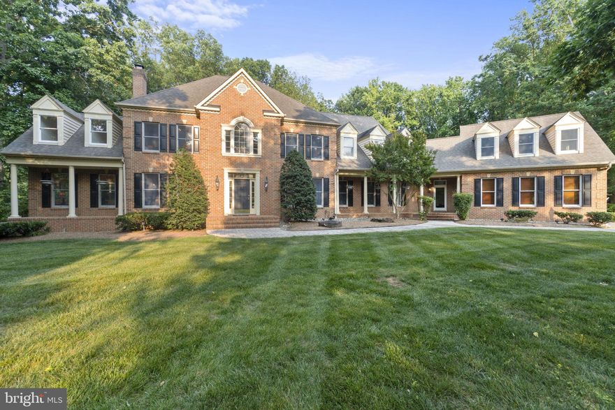Welcome to 1303 Windsor Ridge Lane! This expansive luxury home, located in the Windsor community, offers the epitome of comfort and privacy. Nestled on a private lot in the sought-after Broadneck school district, this home is a gem.  As you step into the backyard, you'll be greeted by a stunning oasis. No sight of neighbors here, just tranquility. The outdoor living space is a dream come true, perfect for entertaining guests or enjoying a peaceful day by yourself. The heated saltwater pool with waterfalls beckons you to take a refreshing dip, and the automatic cover adds convenience, while the outdoor kitchen provides the perfect space for culinary delights to enjoy outside. The pavilion, complete with automatic screens, a cozy fireplace, and a TV hookup, creates an inviting atmosphere day or night. The lot itself offers the utmost privacy, thanks to its elevated position and lush landscaping that surrounds the home.   Inside, you'll find an open floor plan bathed in natural light from the abundance of windows. The kitchen is a chef's dream, boasting upgraded finishes, stainless steel appliances installed just last year, and brand-new cabinets, countertops, and backsplash.  The master suite is a luxurious retreat, overlooking the backyard and featuring a spacious sitting area. The ensuite bath is a haven of relaxation, complete with a walk-in shower, soaking tub, and double vanity. The four additional bedrooms are generously sized, and there's even a bonus room above the garage that can be used for hobbies or as a kids' entertainment area. Each ensuite bath has been completely renovated this year, offering a fresh and modern touch.  The three-car garage floor has been thoughtfully coated with epoxy, ensuring durability and a polished look. A Sonos sound system is thoughtfully installed throughout the home. Downstairs, the fully finished basement boasts a gym, a theater for enjoying movies in style, a bar, additional living space for various activities, a full bath, plus an extra room that can be used as an additional bedroom - there is truly no need to leave your home with all of these amenities that 1303 Windsor Ridge has to offer!  Located just 5 minutes from Route 50, this home offers simple commutes to Annapolis, the beach, and Washington D.C. Whether you're seeking a peaceful retreat, a space for entertaining, or a family-friendly environment, this is the perfect place to call home. Be sure to check out the listing video to truly capture the meticulous details and beauty of this luxurious home!