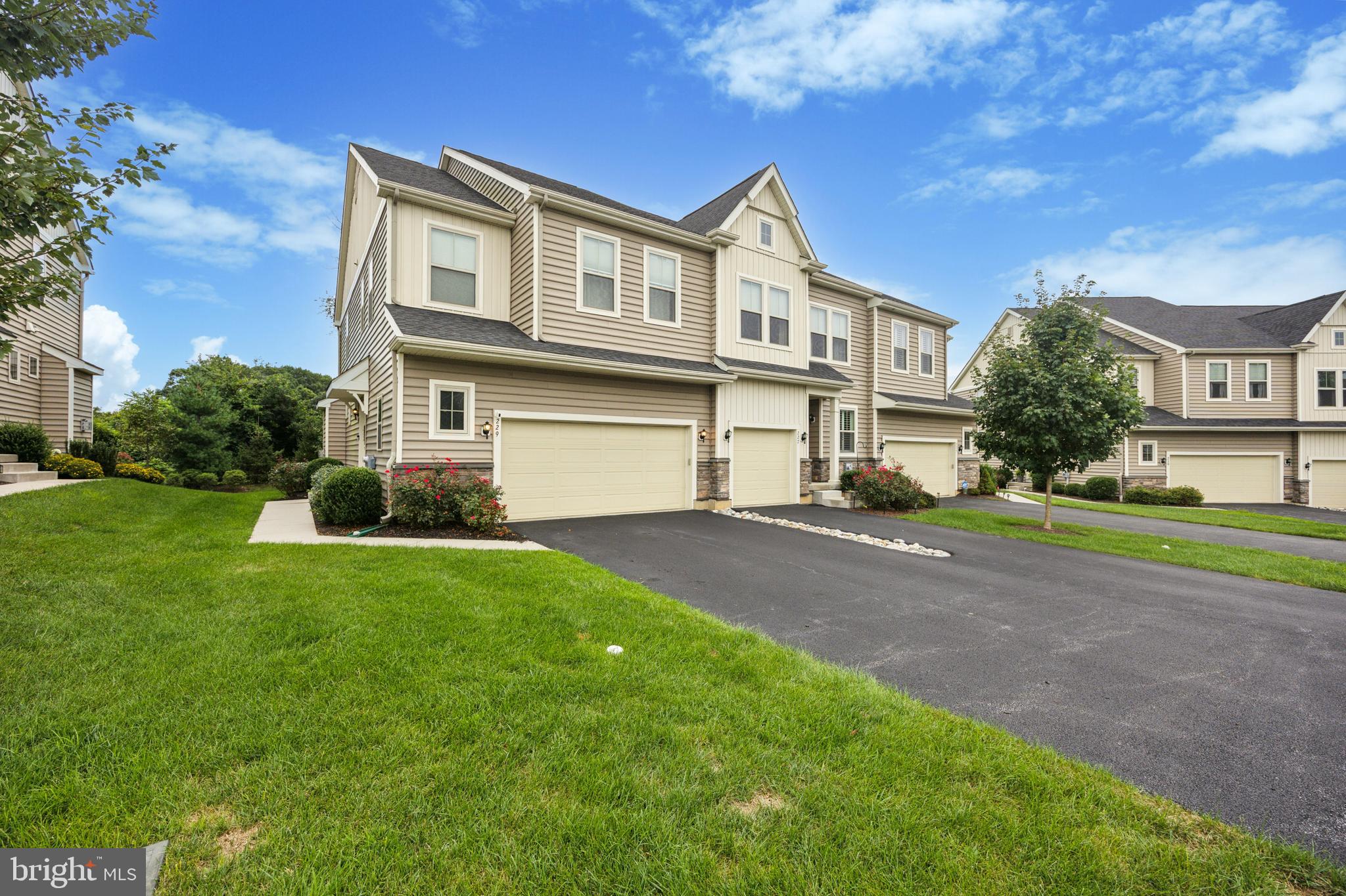 Immaculate, move-in ready end unit in the desirable community of Pemberton! This beautifully maintained home features a bright, open-concept layout with a spacious kitchen that flows into the family and breakfast rooms—perfect for everyday living and entertaining. The welcoming foyer includes a coat closet and powder room, while the family room impresses with volume ceiling recessed lighting, a gas fireplace, and custom window treatments. The kitchen boasts white cabinetry, granite countertops, a tile backsplash, and an island with seating and pendant lighting. A full stainless steel appliance package is included featuring: gas cooktop, double oven, built-in microwave, dishwasher, and refrigerator. The adjacent breakfast area opens to a private deck with a privacy wall and tree-lined views. Upstairs, the luxurious primary suite offers a tray ceiling, recessed lighting, custom window treatments, and dual walk-in closets. The main bath features a soaking tub with tile surround, granite-topped double vanity, and a separate walk-in tile shower and water closet. Bedroom 2 offers direct access to the hall bath, while Bedroom 3 is generously sized. Convenient second-floor laundry with washer and dryer included. A full basement provides abundant storage and great potential for finishing. 2-car garage. All just minutes from Kennett Square Borough, shops, restaurants, and top-rated schools. A must-see!