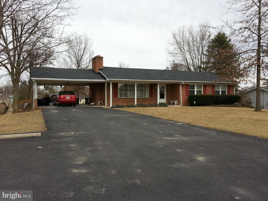 ALL brick rancher with  two beautiful fireplaces (one up, one down), 3/4 finished basement, plus workshop with outside entrance.  House has new roof, large living room, all appliances including washer and dryer, and is in move-in condition. Established subdivision and level lot.  Well insulated with low electric costs.  Inwood/Musselman school district.  Peruse the pictures and give us a call.....