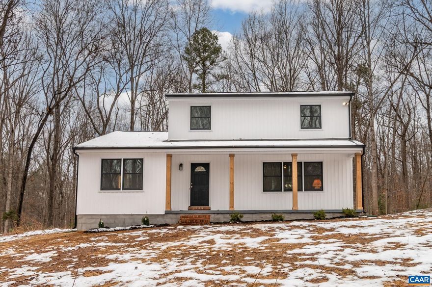 Discover this 4-bedroom, 2-bath farmhouse set on 7.67 private acres, where every major system and finish has been thoughtfully updated?including a brand-new HVAC system, roof, siding, windows, flooring, kitchen, baths, appliances, lighting, deck, water heater, and more. This home lives like new construction while retaining the warmth and character of a classic farmhouse. Inside, the bright and open layout features new plank flooring, refinished original hardwoods, fresh paint, and a beautifully redesigned kitchen with granite countertops, new cabinetry, and stainless steel appliances. The floor plan offers a comfortable flow with an eat-in kitchen, a formal dining room, and charming built-ins. A first-floor bedroom with a full bath provides flexible living arrangements to suit a variety of needs. A full unfinished basement adds valuable future potential. Outside, enjoy a welcoming front porch and a new rear deck overlooking the expansive acreage. The property includes an unpaved driveway with ample parking, no HOA, and a convenient location just minutes from Short Pump. Set in the quiet beauty of Hanover, this turnkey home offers privacy, acreage, and fully move-in ready.
