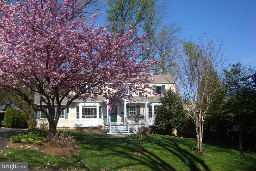 This thoughtfully-designed home boasts an open, expansive layout and 3-level addition. Approximately $250,000 in improvements since 2007. The chef's kitchen features stainless steel appliances, granite countertops, walnut cabinets and a large eat-in area with a bay window. The side porch has been converted to a spacious formal dining room that opens to a deck - great for entertaining. The family/great room addition features custom drapes, oversized windows overlooking lovely wooded views and surround sound. There are three entrances to an outdoor deck through French doors/sliding glass door. The home's 5 bedrooms and 4  baths include 4BR/3BA upstairs. The master suite addition has oversized windows, vaulted ceilings and dramatic wooded views. Heated floors and separate tub/shower in the master bath.  The walk-out lower level features in-law/au pair suite with full bath and recreation room. The main and bedroom levels boast oak hardwood floors and there is berber carpet on the lower level.  The property is professionally landscaped and the sizable, fenced flat back yard includes storage sheds. Unbeatable location just 0.3 miles from popular Lee Heights shops/restaurants and transportation lines. Two lights to DC.