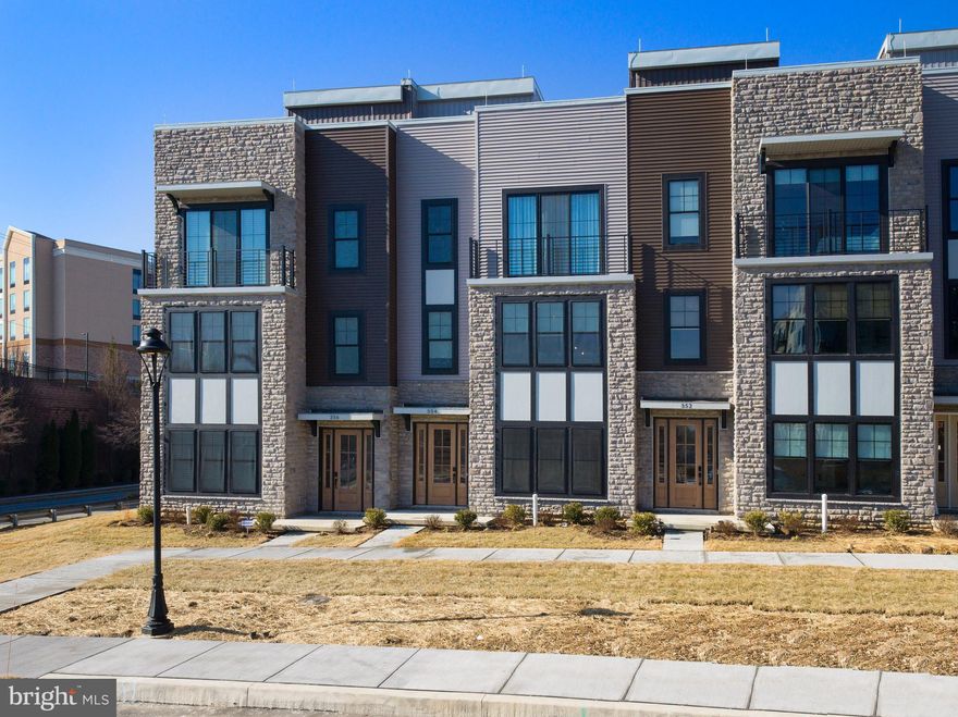 Step into the inviting world of this stunning move-in ready 3-bedroom, 3.5-bathroom townhome, crafted with countless upgrades and exceptional attention to detail. Nestled in the sought-after community of The Towns at Newtown Walk, this home offers a low-maintenance lifestyle with sophisticated style and modern convenience.

From the moment you enter the light-filled foyer, you’ll appreciate the thoughtful design, complete with a private 4-stop elevator, a versatile guest bedroom or office space, and a full bathroom. The rear 2-car garage and spacious driveway provide ample parking and easy access.

The main living level is an entertainer’s dream, featuring soaring 10-foot ceilings and an open-concept design that enhances the natural light streaming through numerous windows. The chef’s kitchen is the heart of the home, showcasing custom cabinetry, upgraded quartz countertops, a grand island, and high-end stainless steel appliances. The adjacent dining area flows seamlessly into the inviting living space, highlighted by a cozy gas fireplace with custom built-ins.

Retreat to the primary suite, where natural light fills the spacious bedroom, easily accommodating a king-sized bed and a large walk-in closet. The spa-like ensuite bathroom boasts upgraded tile, a walk-in shower with a bench, a private water closet, and a double vanity. A secondary bedroom with an ensuite bath, walk-in closet, and a charming Juliet balcony completes this level, along with a convenient laundry area.

The crown jewel of this home is the rooftop terrace—a private oasis with unobstructed views, perfect for morning coffee, outdoor dining, or unwinding under the stars. With space for planter gardening and the potential for a fireplace or BBQ area, this retreat offers endless possibilities.

Built with countless upgrades throughout, this home is truly one of a kind. Located in the heart of Ellis Preserve, it offers unmatched convenience with easy access to major roadways, the airport, the train station, and Routes 252 and 3. Enjoy a walkable lifestyle with nearby shops, dining, and fitness boutiques just steps away.

Don't miss the opportunity to call this elegant, move-in ready townhome your own!