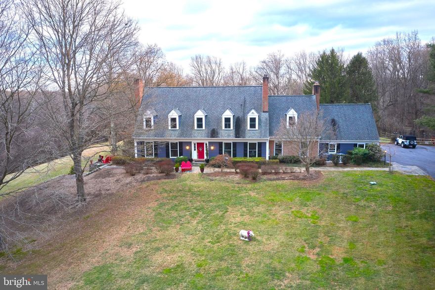 Nestled within the highly sought-after Beallmount Community, this fully updated Gosnell Built Classic Colonial Estate with a contemporary flair is an exquisite retreat, set amidst a park-like private setting with breathtaking scenic vistas on 4.77 acres of natural splendor. The property is graced by the presence of a serene creek running alongside the property, adding to the tranquil ambiance and natural allure.
As you step into the main floor, be captivated by the inviting ambiance created by the refinished hardwood floors, guiding you towards the fully renovated kitchen (2021) adorned with top-of-the-line appliances. The spacious casual dining area, seamlessly connected to the kitchen and adorned with reclaimed wooden beams, emanates a captivating and stylish ambiance that makes a remarkable statement within the home. This inviting space leads to the cozy family room, featuring its large brick gas fireplace. The living room boasts a wood-burning fireplace and opens to an additional sitting room with idyllic back yard views, complemented by an entertainment bar area. An expansive home office provides a perfect sanctuary for work or relaxation, offering a versatile space for various pursuits. Ascending to the upper level, with replaced wood floors throughout, you will discover a haven of comfort with 4 bedrooms, including a luxurious primary suite featuring a fireplace and an updated ensuite bath. Three secondary bedrooms offer generous closet space, along with two updated hall baths, and a conveniently located laundry room. Front and back staircases enhance the accessibility of the upper level, adding to the overall charm of the home. The basement beckons with a fully finished walk-out design, presenting a recreational room, a newly mirrored fitness area, a full bath, a bonus room, and ample storage space. The infusion of new tile flooring brings a touch of modern elegance to this versatile space, catering to various lifestyle needs. Step outside to the enchanting exterior, where panoramic views await. An expansive entertaining patio adorned with a pergola and awning, along with outdoor audio speakers, creates a captivating setting for gatherings and al fresco entertaining. A firepit area with a grilling spit offers a cozy retreat for outdoor culinary delights and relaxation. The property also showcases a meticulously tended vegetable/herb garden, complete with a deer fence and irrigation, alongside a 2-car garage with a driveway accommodating an additional 4 cars, ensuring convenience and functionality.
Further enhancing the allure of this exceptional property are the windows and doors replaced in 2018, 5 fireplaces (1 gas and 4 wood-burning), a full house generator, updated and recessed lighting, crown molding and numerous built-ins, adding a touch of luxury and practicality to the home.
This meticulously updated colonial masterpiece offers a seamless blend of classic charm and contemporary luxury, presenting a truly remarkable living experience in a tranquil and expansive setting, where every detail has been thoughtfully curated to elevate the lifestyle of its fortunate residents. 
The tight-knit Beallmount Community is renowned for its vibrant social events and convenient proximity to Potomac Village. Residents enjoy the nearby walking, biking and horse trails, with the added benefit of easy access to the Potomac River for launching your kayak. The neighborhood is served by Churchill Schools, providing access to all the educational opportunities and resources they have to offer.
Sunday's, 3/3, Open House Cancelled due to Pending Status.