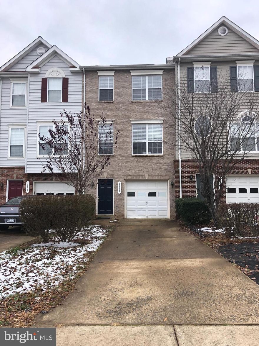 Great 3 level brick TH w/ 3 bedrooms, 2 full baths & 2 half baths. New Carpets/New Paints/Newer Appliances!!!!Open kitchen w/ breakfast nook overlooks dining/living room. Large deck for relaxing overlooking common area. Master bedroom w/ master bath & 2 other bedroom & full bath.  Rec Room in lower-level w/ walk out to yard. Attached 1 car garage. Easy access shopping, and commuting options.