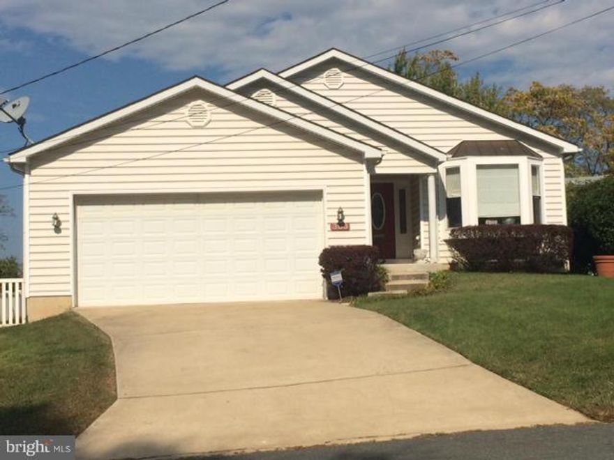 WOW!! CUSTOM BUILT CONTEMPORARY RANCHER WITH CATHEDRAL/VAULTED CEILINGS THROUGHOUT ENTIRE MAIN LEVEL AND HARDWOOD FLOORS!! ATTACHED 2-CAR GARAGE. FRESHLY PAINTED. NEW BEDROOM CARPET BEING INSTALLED. NICE, PRIVATE REAR DECK. FULL BASEMENT, PARTIALLY FINISHED WITH 1/2 BATH. A REALLY COOL HOME.