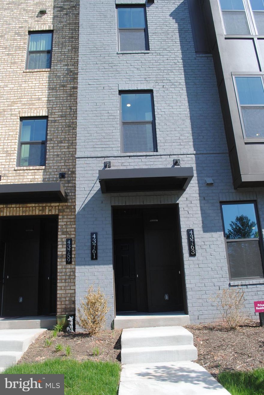 Brand new townhome style condo with 3 bedrooms and 2.5 baths and One car garage located minutes to the Ashburn metro station.   The main level features great room overlooking dining area and gourmet kitchen with Quartz countertops and island.  The home also features outdoor living with a great size sky lanai with a fireplace.  The second level features  2 great size  bedrooms on one side and the other side is the luxury master bedroom with a great size walk in closet.  The master bathroom features dual vanity with seated shower.  Full size washer and dryer with a sink is conveniently located on the bedroom level.