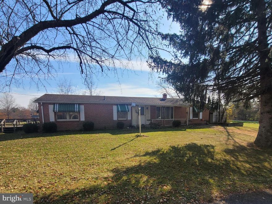 Huge price reduction on this brick rancher with detached garage. Great opportunity awaits to renovate this home situated on a level .50+/- acre in a desirable location.  Renovation loan or cash offers will be considered.