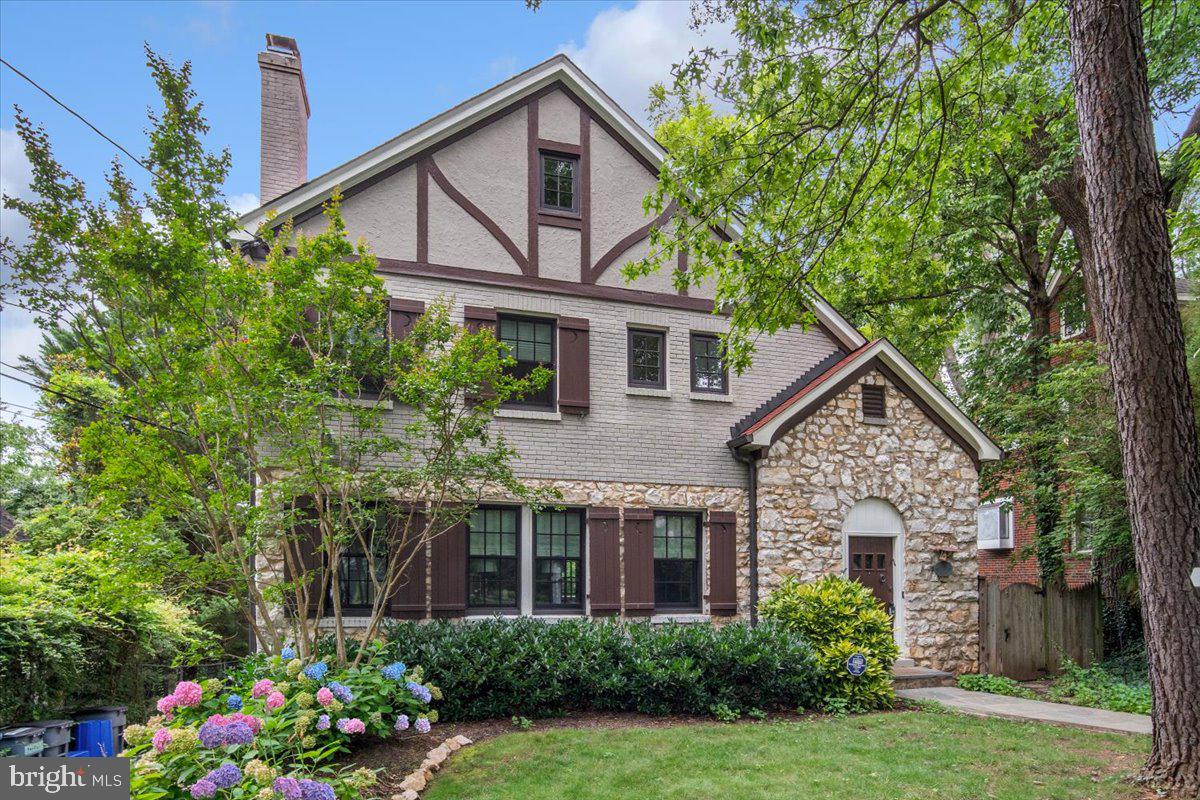 Welcome to 4619 Langdrum Lane, a beautifully maintained residence in Chevy Chase West, just over a mile from both Bethesda and Friendship Heights Metros. Enjoy close proximity to Norwood Park, the Capital Crescent Trail, and Somerset Elementary. This four-level home offers classic charm with thoughtful updates and abundant natural light.
The main level features a renovated kitchen with island seating and open flow into the dining room, a spacious living room with fireplace, and a sunroom framed by elegant stone archways. Upstairs includes a serene primary suite with ensuite bath and multiple closets, plus two additional bedrooms and a hall bath. A fireplace adds charm to one of the bedrooms.
The top level offers a private retreat with bedroom, sitting area, walk-in closet, half bath, and storage. The walk-out lower level includes a large family room, home gym, laundry, half bath, and full daylight exposure.
Outside, a stone patio and landscaped backyard provide a peaceful setting. The redone driveway offers off-street parking, completing this rare offering in a highly desirable location.
All measurements are approximate. Property details and square footage should be independently verified.