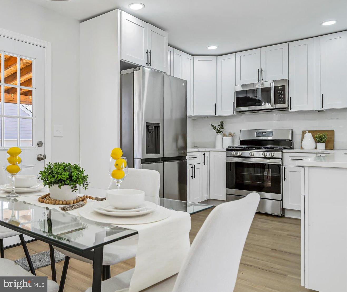 Welcome home to 3611 Kenmar Rd in Windsor Mill! This 5 bedroom, 2 bath single family home is move-in ready and boasts upgraded finishes throughout. When you step inside, you'll be greeted by beautiful LVP floors and abundant natural light. The modern dream kitchen has been tastefully updated with quartz counters, a tile back-splash, high end cabinets, and stainless steel appliances. All bathrooms have been updated with stunning finishes, including high end tile and upgraded vanities. Adjacent to the kitchen is a spacious living room. The main level also features 2 bedrooms and 1 full bath. Upstairs, you'll find bedrooms 3 and 4. The fully finished walkout basement offers a family room, space for a home office or gym, and an additional bedroom and full bathroom. Outside, you'll find a paved driveway and a detached garage. The backyard includes a deck, perfect for entertaining and enjoying the outdoors. New roof, new siding, new windows, new HVAC, ready for you to move in! 1 year Home Warranty included! Conveniently located with easy access to 695.