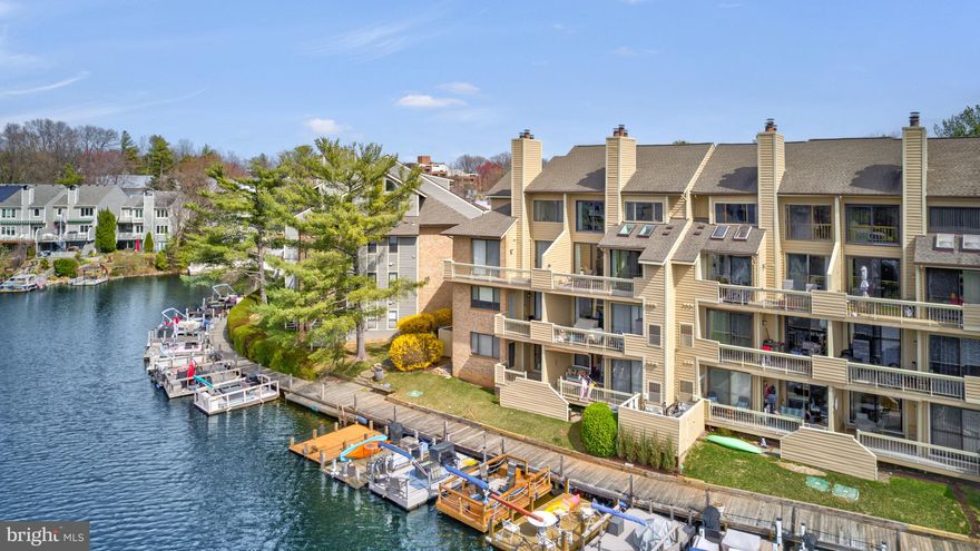 Welcome to 11272 Harbor Court, a stunning lakefront home with a beautiful ‘long’ view of Lake Thoreau and dock access. This exceptionally designed 2.5 level residence will wow you with almost 2000 sq. ft of finished living space, 2 bedrooms, 2 full bathrooms, and a rarely available 2-car detached garage. PLUS there is additional parking (with parking tag) so that parking is never a concern. With breathtaking water views in a walkable, waterside community, this home is a rare offering for your most discerning buyers .

Step inside to an airy three-story foyer filled with natural light. The main level showcases hardwood floors, leading to a spacious living room with a dramatic two-story natural stone fireplace. Sliding Anderson glass doors (2020) open to a private balcony with spectacular views of Lake Thoreau, creating a peaceful retreat. The adjacent dining area provides direct access to the balcony as well, offering seamless indoor-outdoor living.

The updated gourmet kitchen is both stylish and functional, featuring a breakfast bar that serves as the perfect space for casual dining. High-end stainless steel appliances ((refrigerator, stove 2023) and a hidden pantry with pull-out shelves, along with tons of storage enhance this generously-sized kitchen’s appeal.  A bedroom (new carpet-2025) with large walk-in closet and full bathroom (updated 2022, 2025) along with a cozy reading nook or office space adjacent to this room complete the main level.

The upper level features a spacious loft with vaulted ceiling (new lighting fixtures - 2025) and an open overlook to the living area below.  The primary bedroom is a tranquil retreat, with a beautiful cathedral ceiling and large windows that frame serene water views. The spa-like primary bathroom offers a double vanity and a glass-enclosed shower with windows. A walk-in closet with built-in Elfa shelving completes this luxurious suite.  The convenient laundry room and a spacious walk-in attic storage room with built-in Elfa closet systems can also be found on this level, directly adjacent to the primary bedroom. Updated lighting throughout the home (2025), and new HVAC (2023- 10 year manufacturer's warrany conveys). For water enthusiasts, dock spaces located directly in front of the condos on the lake are available, and perfect for docking a pontoon or floating dock.

Residents of this exceptional community enjoy a private boardwalk and access to Reston Association amenities, including pools, tennis courts, a community center, lakes, ponds, and miles of scenic walking and biking trails. Just steps from South Lakes Village Shopping Center, you’ll find everything from Starbucks to Safeway for everyday conveniences. The nearby Cross County and W&OD trails provide endless outdoor recreation. Reston Town Center, Reston National Golf Course, and Reston Station Metro Plaza with dining and entertainment are all within easy reach. Conveniently located near the Dulles Toll Road and Fairfax County Parkway, with quick access to Dulles International Airport, this home offers the perfect balance of tranquility and urban accessibility.

Experience the best of lakefront living at 11272 Harbor Court.