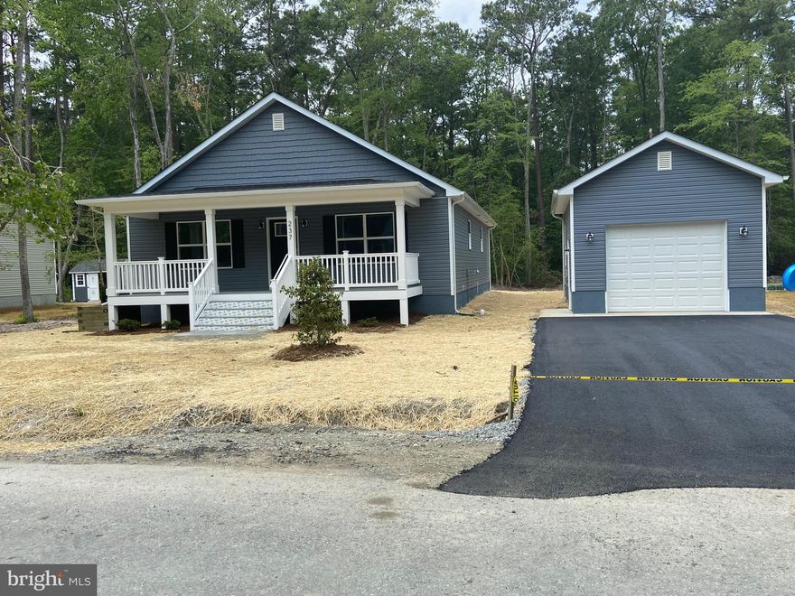 New construction in Town of Colonial Beach, VA. ready for immediate occupancy. Charming ranch style home with detached one car garage.  One floor living with flowing floorpan. Kitchen with upgraded granite countertops, upgraded cabinets, and GE appliances. Pella windows. Upgraded LVP flooring throughout.  Beautiful low-maintenance Timber-tech front & back porches.  Back porch with room for seating or grilling. Conditioned crawl space. Asphalt driveway. Back yard vinyl privacy fence.