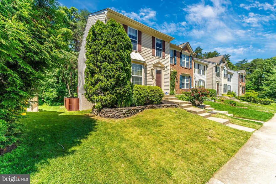 Fantastic, sunny home backing to trees with bump-outs on ALL THREE LEVELS.  Wow, does this make for an incredible space - enjoy your kitchen with island and large open rooms on 2 sides - use one for dining room table space, one for home office/play area/reading nook/sewing space - so many possibilities for this great space! On the upper level enjoy a spacious primary suite with 2 walk in closets and a beautifully updated master bath with granite counters, ceramic tile floor, custom seamless glass shower, soaking tub, and dual recessed medicine cabinets. On the lower level, you get an additional space for an office or a guest room (or possibly close it in to make a 4th bedroom!) while still enjoying a large living or rec area.  Other great features are the bay window, large living room, updated baths, gleaming floors, fresh paint, and a WALK OUT basement.  This great location offers a cool woodsy area in the middle of the parking court - where you have 2 reserved spaces plus ample visitor parking.  Great location off the Rotary - so close to the pool!  And of course you will love the many amenities of the Piney Orchard community - 3 outdoor pools, an indoor pool, the fitness center, the paths, the trails, the tot lots, the doggie stations, the tennis courts, the summer farmers market, and the list goes on!  Grocery and restaurants right down the street. Fantastic commuter location near Ft. Meade, MARC train, and Rt 32. You will love your new home!!