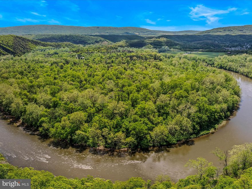 Discover the perfect blend of seclusion, natural beauty, and development potential with this exceptional 11-acre property nestled along the Potomac River. Featuring two separate lots, each with elevated building sites out of the flood plain, this unique property provides ample space for your dream home(s), weekend getaway, or investment opportunity. Enjoy peace of mind and privacy with no future neighbors across the river, as the property faces the protected lands of the Paw Paw Tunnel and Chesapeake & Ohio Canal National Historical Park. A generous stretch of river frontage offers breathtaking views, recreational access, and a tranquil atmosphere. Underground electric service is already in place, ideal for easy RV hookup or future construction. Located at the very end of a private lane, this rare riverfront escape offers unmatched serenity while keeping you connected to the essentials. Whether you're looking to build, camp, or simply invest in a slice of waterfront paradise—this property checks every box. Need more space and a cabin? The adjoining 13+ acres and a beautiful cabin are also for sale! Call your agent today to schedule an appointment to see one or both of these properties. You won't be disappointed!