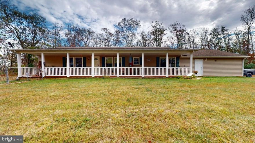 Wind your way down a country road to find this 2 bedroom 2 bath rancher on 5+ acres in the Hills of WV.   This gem shines above others with so much to offer.  2 car attached garage, out buildings and an off grid guest house.  Separate laundry room with outside access has room for so much more.  Desk space, freezer, day bed??? Options are many.  The garage is extremely spacious and clean with storage and work space included. Need a 3rd bedroom?  Consider relocating the laundry to the garage and there you go, 3 bed, 2 bath possiblity.