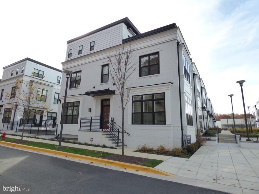 Perfectly positioned between the vibrant retail scene of the newly revitalized Cabin John Village and the natural beauty of Cabin John Regional Park, this exceptional new townhome promises a lifestyle of unparalleled convenience and luxury. Boasting open and thoughtfully designed floorplans, an included elevator, a warm gas fireplace, a private rooftop terrace, and a spacious two-car garage, every detail has been meticulously crafted for your comfort.

Indulge in the ease of strolling to nearby restaurants and boutiques or immerse yourself in the tranquility of the surrounding trails and park features, all just steps from your front door. Revel in the seamless integration of wide-plank flooring throughout, creating an atmosphere of modern elegance. The chef-inspired open kitchen beckons with its quartz countertops, deluxe stacked cabinetry, and high-end appliances, promising a culinary experience that exceeds expectations.

Embrace a life of opulence as you discover the luxury living you've longed for. Your new home is not just a residence; it's a testament to sophistication, convenience, and the art of living well. Welcome to a residence that transcends expectations and embodies the epitome of refined living.