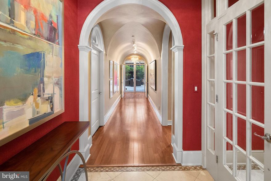 Imagine walking off of an elevator directly into your own full-floor condominium.  Without cramped hallways to share with other residents, this beautifully appointed and refined condo feels very private and exceptionally luxurious. Unit 200 at the pet-friendly “The Beaumont” features two (2) car parking in a gated enclosed garage, as well as, one of the largest outside terraces in the neighborhood … just perfect for both relaxing nights at home or sharing glasses of wine with ALL  of your friends. The 900 sq. ft. terrace has that wow factor, with its extremely high privacy fence that sits on a stone base, many large wall sconces, trendy floor pavers, and an irrigation system!  It is such a great opportunity to own a split two (2) bedroom, two and a half (2.5) bath home located in a vibrant and energetic part of the city, while still offering your own personal oasis. This exceptional 2740 sq. ft condo boasts a separate entrance anteroom, an open floor plan with a large window expanse, Santos Mahogany hardwood floors, a barrel ceiling hallway connecting east to west, ceiling fans, track and recessed lighting, sconces and three (3) chandeliers, a built-in entertainment console with gas fireplace and built in desk, a gourmet kitchen with high-end appliances, Sub Zero refrigerator, GE Monogram double wall ovens and four burner range with with grill, Fisher & Paykel double dish drawers, soapstone and granite countertops, extra large island, a main bedroom large enough to make a cozy sitting area, a finished walk-in closet, Calcutta marble bath, two (2) person shower with body sprays and a soaking tub, a separate toilet room with bidet, and a bar alcove with copper sink and built-in Sub Zero wine fridge. There are a total of three outdoor spaces.  In addition to the private terrace, there is a balcony in the front overlooking green space, and the future Penn's Landing Park, connecting you directly to the Delaware River. From a functional standpoint, there is a laundry room with storage cabinetry and washer and dryer, several storage closets, TV’s, Silhouette type blinds, tasteful draperies, and a Virtual Concierge for the building. Come see this luxuriously appointed, move-in ready home, and experience everything it offers. This refined space is the perfect place to call home.