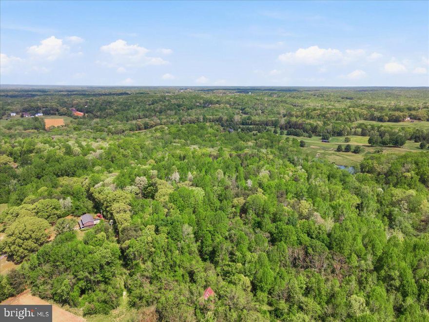 Unlocking unparalleled equity and immediate velocity, this premier 13.84-acre ridgetop tract is the ultimate canvas for a private luxury estate or an immediate multi-generational family compound. Unlike raw, unproven land, this property has been extensively de-risked with thousands of dollars in advanced engineering and civil due diligence completed. Development Highlights Include: Shovel-Ready Status: Active Calvert County Health Department (CCHD) conventional septic renewal approved through March 2028 for a luxury 6,000+ sq ft dwelling footprint based on two fully passed, certified perc locations (Sites B and C). Bypass the county’s restrictive 12-to-18-month "Wet Season" testing windows and start building immediately. Massive Infrastructure Savings: Certified soil logs confirm a 100% natural, gravity-fed system layout for both approved perc sites—saving an estimated $12,000–$15,000 by completely eliminating the need for expensive mechanical effluent pumps or advanced pre-treatment (BAT) units. 
The Dual-Lot Strategic Advantage: Complete proprietary, georeferenced civil CAD datasets (.dwg formats) convey with the sale. The engineering data provides an explicit roadmap to execute a phased minor subdivision, splitting the approved percs geographically to establish two independent buildable lots rather than one. Build your dream estate on Lot A (utilizing Perc Site B) and preserve a completely separate, shovel-ready Lot B (utilizing Perc Site C) for a future family home or an immediate, high-yield land disposition play. Perfected Access: Legally recorded, non-exclusive 25-foot private access stem and established driveway easement agreements ensure clear, friction-free title insurance issuance. 
Perched on a quiet, scenic ridge yet highly accessible, this property offers an elite buyer thousands in immediate out-of-pocket engineering savings and a fast-track timeline. Full technical data vault containing CAD files, stratigraphy profiles for Sites B and C, and county approvals available to serious inquiries. Selling as-is. Bring your builder and your vision!