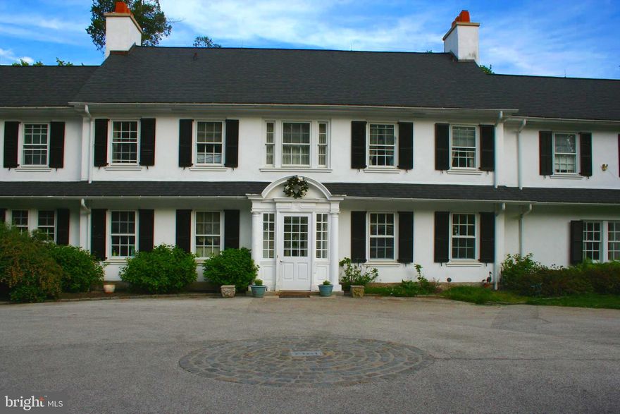 Located at the end of a winding driveway overlooking the famed 15th hole of Merion Golf Club, sits the majestic "Windy Knoll", a classic Trumbauer estate built in 1912. With original details delicately preserved, this house is a truly stunning. The main level of this home features an entrance hall, living room, library with built-in bookshelves, powder room, sunroom, grand oversized dining room, kitchen with bar area. Features throughout this home include pocket doors, multiple French doors allowing the home to open to outside entertaining, beautiful refinished original herringbone pattern wood floors, crown molding and 4 fireplaces. The 2nd level features a private owners suite with a sitting room, his and her closets and separate shoe closet, fireplace and an owner's bathroom with whirlpool tub, 2 bedrooms connected by a jack-and-jill bathroom, 3 additional bedrooms, and 2 additional hall bathrooms, views of the Philadelphia skyline can be seen from the second floor back bedrooms and hall windows, and back stairwell leading to the downstairs kitchen. The Carriage house includes a great room setting, full kitchen, and ADA full bathroom, with a  second floor bedroom and full bathroom. Sitting on approximately 2.5 acres the property also includes a private pool, patio and sweeping views of the golf course. This property is being sold ‘as is’. Make your appointment to see this stately home today.