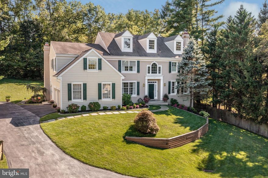 This classic, walk-to-Wayne colonial marries an elegant and spacious interior with a beautiful, calming exterior. With four bedrooms and three full bathrooms, as well as a finished lower level and attached two-car garage, you have the room you need in a location that is also ideal: within the sought-after Tredyffrin-Easttown School District and proximity to Main Line towns and all they offer, along Route 30. The attractiveness of the home begins with a pretty walkway, flanked by mature plantings and leading to a gracious front door and entryway. The elegant foyer, topped with distinctive windows and with two closets, leads to the living and dining rooms on the right. The living room, with a white-mantel fireplace, has generous windows, high ceilings, and distinctive crown molding. The dining room features hardwood floors and wainscoting. To the left of the foyer is a home office next to a full bath with stall shower - convertible to a first-floor bedroom with bath if desired. The kitchen is an ideal destination for both preparing everyday meals and hosting. It brims with attractive features, including granite countertops, a center island with bar seating, lovely white cabinets, some with glass doors, and tumbled marble backsplash. An elegant bar area with separate sink adds to the prettiness of the room, while professional, stainless steel appliances, including a gas Wolf oven range, make cooking easy. The adjacent breakfast/morning room is sunny and bright, with sliders that open to the spacious deck and backyard. The ongoing spaciousness flows from the kitchen, leading to a carpeted family room that has a white-mantel fireplace and two-story, vaulted ceiling with fan and two skylights. Both the pantry and laundry area are next to the kitchen, with convenient garage access as well. Ascend to the second level - The main bedroom, carpeted and with two walk-in closets and a separate sitting area, features an updated bathroom with double vanity, a soaking tub, and walk-in shower with elegant tiles. Each of the three additional bedrooms is carpeted, while the charming hall bathroom has a double vanity and tub/shower. From the second level, a walk-up, floored attic provides extra space and expansion possibilities. The finished, walk-out lower level, with its spacious family room, exercise area, and workroom, has something for everyone. The two-car attached garage off the kitchen provides even more room for storage. Enjoy all seasons from the lovely exterior, with its extensive deck and its secluded, verdant backyard. Located at the end of a private lane within the Deepdale neighborhood, the home is also within walking distance to the center of Wayne. The Deepdale civic association also provides community events throughout the year. With terrific schools, shopping and restaurants in Wayne, Strafford and King of Prussia, the library, and parks close by, and close to major routes including 30 and I-476, this home has so much allure!