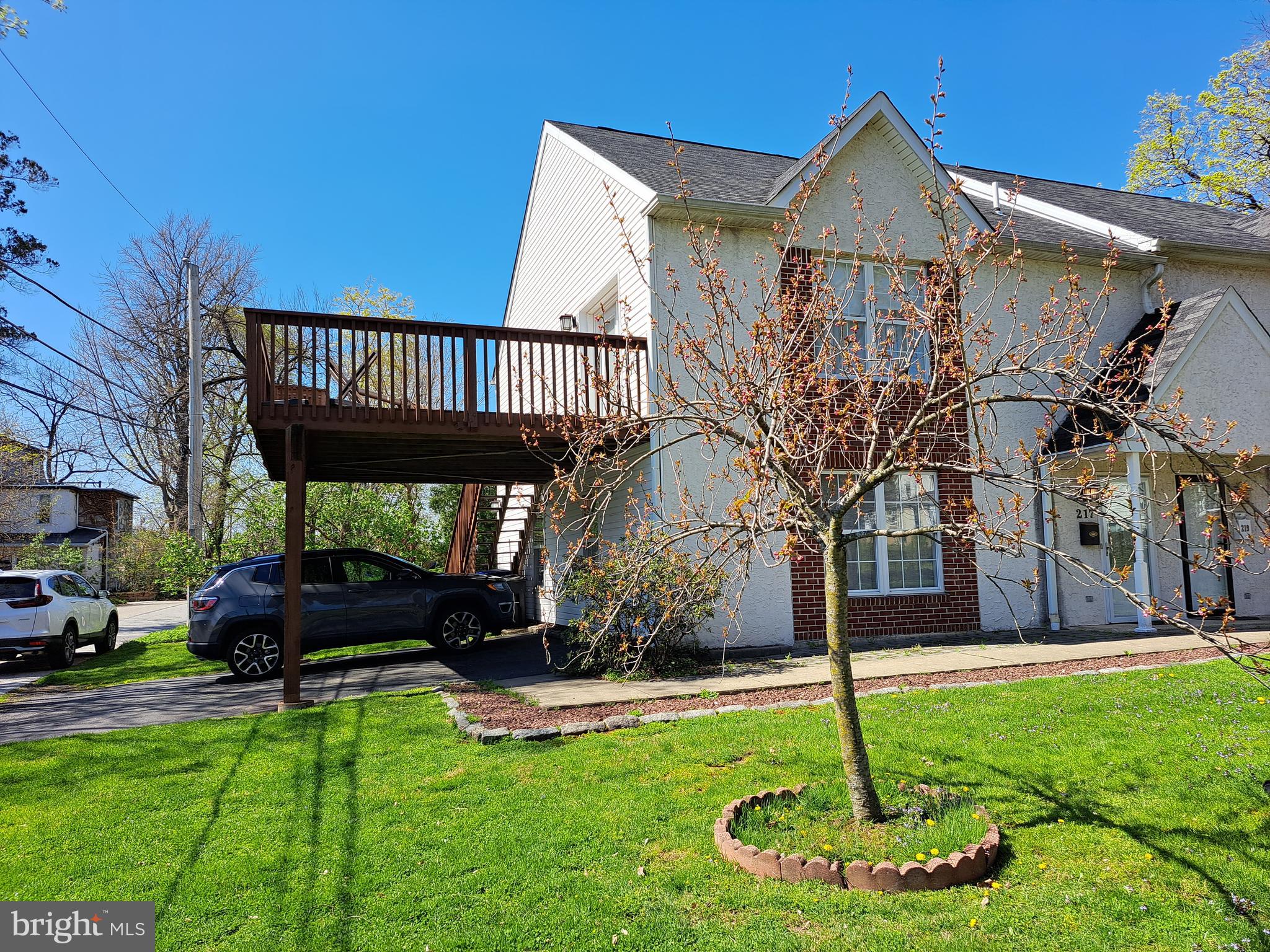 also known as 217 N tyson according to the courthouse. FOLLOW MY DIRECTIONS This Carriage House Townhome is perfection.Located on a little 'horseshoe street' it seems very rural but ohhhh sooooo convenient.  Beautiful wood like floors. Open Floor plan for ease of furniture placement.  Lovely dining area.  There are sliders to the patio and yard. Beautifully appointed kitchen with plenty of space for the serious gourmet.  First floor laundry with an abundance of storage available. The coat closet and powder room  make it complete. .  Second floor is spacious and bright. Main Bedroom has his and her closets and access to the 18' x 14 ' deck for morning coffee or relaxing evenings and everything in between.  Two additional generous size bedrooms with more than ample closet space. The hall bath is exquisite tile and nicely laid out. This home features the ease of everyday living or is perfect for casual or formal entertaining.  Perfect location for convenient shopping, schools, recreation and cultural activities. Walk to bus or train or shops on main drag...Convenient proximity to main arteries and turnpike.
