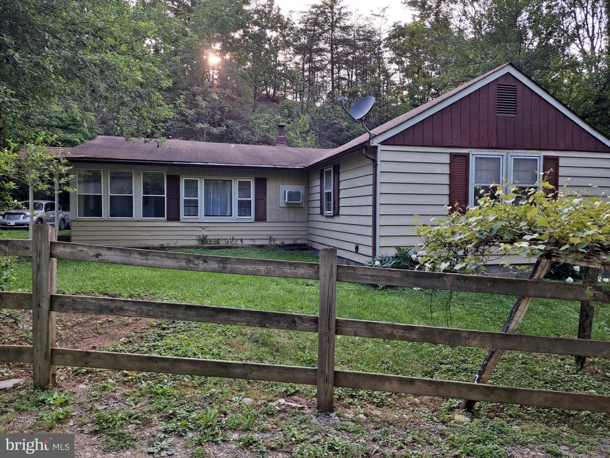 Happiness is just a Hollow away! Must see this beautiful home located on Happy Hollow Road just miles from Petersburg, WV.  You have the luxury of country living but located close to the convenient of all the amenities of downtown Petersburg.  This home located in Almost West Virginia is close to so many wild and wonderful places to enjoy.  It is located near Seneca Rocks, Dolly Sods, Spruce Knob and Canaan Valley, South Branch of the Potomac River and so many others.  It can be your forever home or a wonderful weekend getaway.  Call for a showing today!