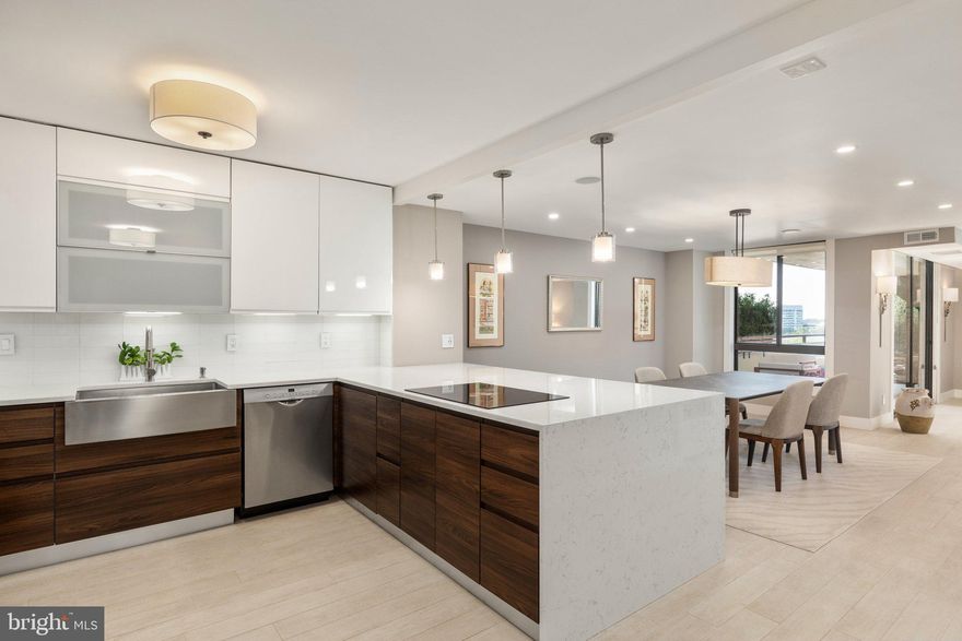 Come and discover this exceptional luxury condominium that epitomizes contemporary elegance and style at the Regency at McLean. This 2-bedroom, 2-bathroom condo is a true gem, boasting an array of high-end features and finishes that set it apart from the rest. With a spacious and bright interior spanning 1,890 square feet, this home offers an unparalleled living experience in McLean. <br><br> 

Step inside and be greeted by a chic open floor plan adorned with Corso Italia porcelain tile flooring and custom Farro & Ball paint, creating a sophisticated ambiance throughout. The living and dining rooms are generously sized, providing ample space for both relaxation and entertainment. Prepare to be captivated by the stunning TV accent wall crafted with exquisite limestone, adding a touch of unrivalled luxury to the space. <br><br>

Get ready to be dazzled by the extraordinary kitchen, meticulously designed to impress even the most discerning chefs. It features a stunning Waterfall Quartz countertop, luxurious Italian-made Unica soft-close cabinets, and top-of-the-line Bosch appliances, including an induction cooktop, double oven, and a Zuhne farmhouse sink. The kitchen pantry with Elfa customized shelving is both functional and visually striking. LED recessed lights, designer fixtures, Lutron screwless wall plates, dimmers, and smart lighting add a touch of modern sophistication. The built-in speakers from Dayton, controllable from your phone or iPad, create an immersive audio experience.  <br><br>

The primary suite is a haven of luxury, complete with another Elfa customized walk-in closet system and a spa-like en-suite bathroom. Dual sinks, a Vigo 6-jet shower panel, rain shower head, and modern lighting create a lavish retreat. Sliding doors lead to a balcony that overlooks the serene green courtyard and offers breathtaking views of the pools and the stunning Tysons Corner skyline. <br><br>

The second room is versatile and can be used as a potential additional bedroom, den or study. It features an attached bath, finished to the same impeccable standards as the primary bath. This home boasts additional luxury touches, such as oil-rubbed bronze door handles, 5-inch baseboards and pocket doors.  <br><br>

The Regency at McLean offers a plethora of amenities including multiple pools, a library, convenience store, hair salon, and grill areas outside. It is also gated with a 24/7 manned front desk and controlled access. For fitness enthusiasts, there is indoor access from the building to the state-of-the-art OneLife Fitness facility next door, complete with many exercise classes and even a delightful restaurant. <br><br>

The location of this property is truly unbeatable, with a pedestrian/bike bridge just outside the community that takes you to the mall at Tysons Corner Center. Highly rated restaurants, shops, movies, the Capital One Hall for performing arts, and grocery stores, including Wegmans, are all within close proximity. The McLean Metro station is just at the end of the street within 1 mile, and quick access to the Beltway, Rt 66, GW Parkway, and Dulles Toll Road makes commuting a breeze. <br><br> 

Nestled in the hub of McLean and Tysons Corner, this condo is a beacon of luxury living. Don't miss the opportunity to call this remarkable property your home, where comfort, convenience, and sheer luxury await you at every turn.