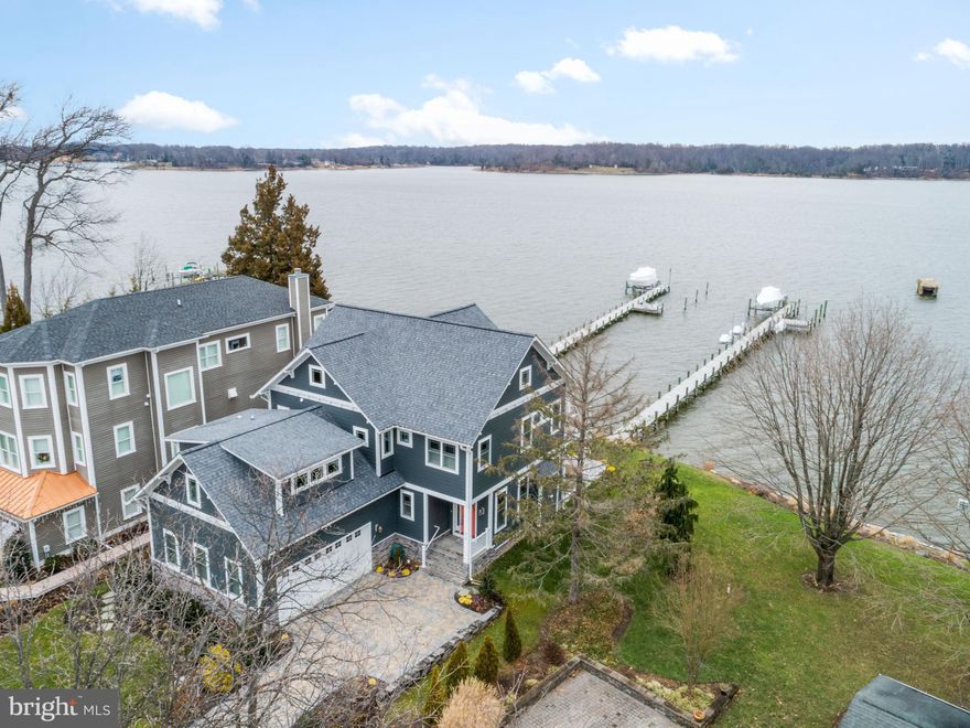 WATERFRONT in Loch Haven Beach!  Situated on one of the sought after points on the South River this 4 bedroom, 3 full baths/2 half bath craftsman inspired home boasts a dramatic open floor plan throughout.    Enter through the front door and soak in the wide open views of the South River from every angle! This home was built only four years ago and offers features of newer construction.   Bright and spacious living room with high ceilings and windows galore, coffered ceilings, gas fireplace, large glass sliding doors exiting to the covered deck lounge area -allowing you to expand your indoor living to the outdoors!  Custom gourmet kitchen with stainless steel appliances, double ovens, gas cooktop, granite counters, and large kitchen island combined with spacious dining & entertaining areas.  Main level office/study, upper level laundry room with wet sink and cabinetry, custom window treatments and plantation shutters throughout, newly upgraded washing machine & dryer, top of the line carpet recently installed in all bedrooms, walk-in closets in every bedroom, gorgeous master en suite with soaking tub, separate tiled shower, dual closets, balcony over looking the river and more!  Exterior improvements include 250' pier with electric & water.  15,000 lb boat lift and three 1,500 lb RotoMag lifts (all with remote controls). Stairs from the pier to the back and yard and extensive landscaping to include underground irrigation system and custom permeable paver driveway!  WOW!  A water lover's dream!  Perfect for your weekend getaway or make everyday a vacation from home!  Loch Haven community amenities include a baseball field, basketball, volleyball and tennis courts, sandy beach with netted swimming area, private community only marina, playgrounds and more!  Excellent location for commuting with easy access to Rt 50 and 97, tons of shopping options, restaurants, doctors/medical needs, the Edgewater library and South River schools!   Per the prior builder the tax record SF is incorrect.   Should be 3015 SF ***COVID-19 precautions: Limit three persons (2 clients and 1 agent), please wear a mask while inside the home, don't go if you feel unwell, and wear shoe covers (provided) or remove shoes while inside the home.  Please leave lights ON to minimize overexposure.***