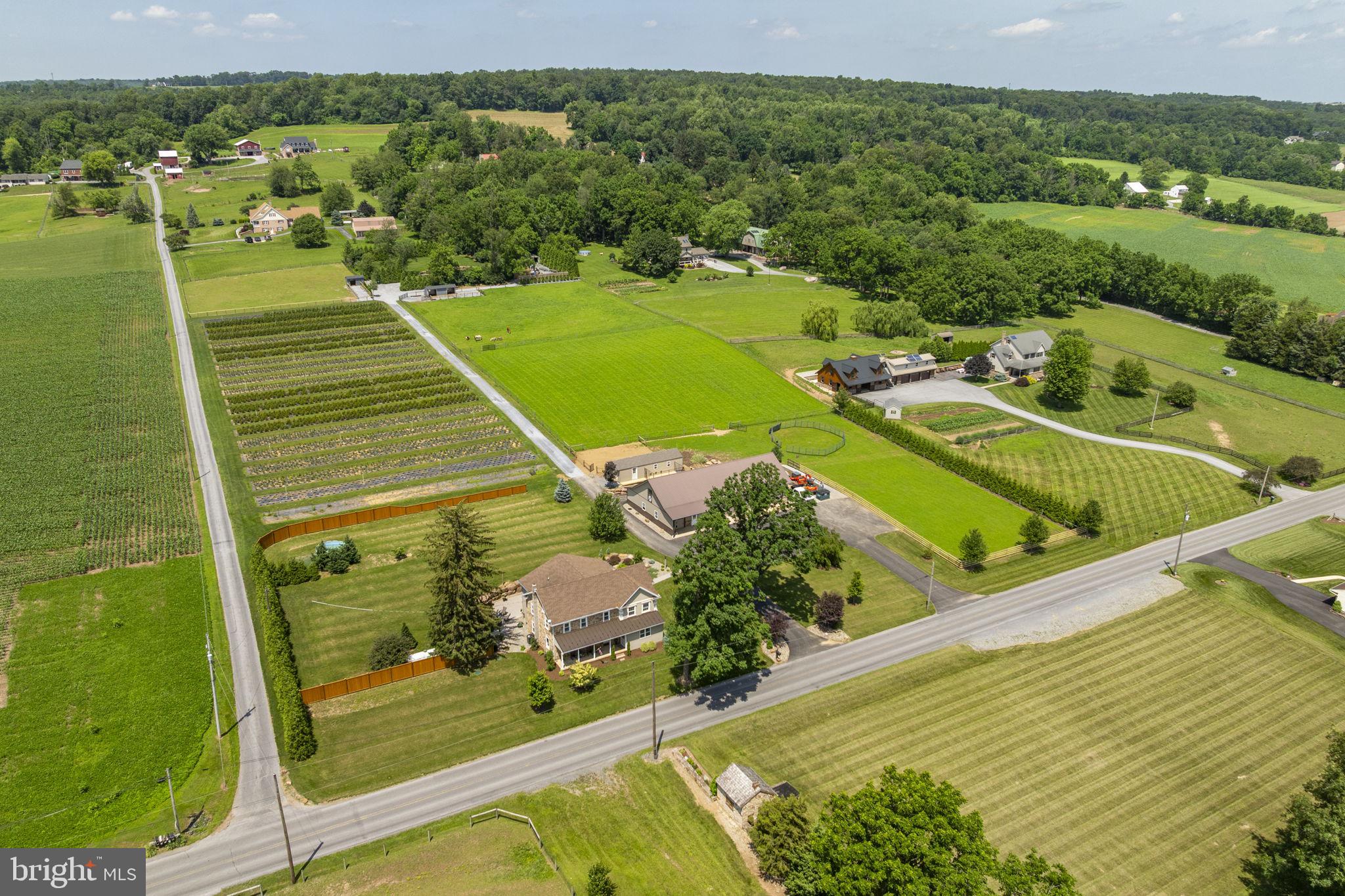 AUCTION DATE - WEDNESDAY, AUGUST 13, 2025, AT 4 PM. LISTED PRICE IS AN OPENING BID ONLY AND IS NOT INDICATIVE OF THE FINAL SALE PRICE. REAL ESTATE: 7.3 ACRE Farmette w/2½ sty. stone/frame dwl. (original sandstone part dated 1864) w/3896 SF finished area w/country eat-in kitchen w/beautiful ash raised panel cabinets w/pantry & appliances, living & family rms., 1st floor laundry w/2nd kitchen, mudroom, 4 bdrms. (primary bdrm. suite w/nursery & walk-in closet), 2 full baths, office, full attic & bsmt. w/finished rec. rm., LP gas radiant floor heat, central AC (2nd floor - new 2025), Colonial trim & raised panel doors throughout, insulated/tilt windows, whole house fan system & rear concrete patio area 20x40. Outbldgs.: 1½ sty. frame/painted steel shop bldg. 32x75 w/(3) 12x10 insulated overhead doors, 32x55 insulated shop area, 32x20 horse stable w/9x8 overhead door & 2nd floor storage, 14x40 insulated frame garage shed w/dog kennel, chicken coop & fenced-in yard area all on 7.3 ACRES w/3 acre fenced pasture w/2 run-in sheds & new board fence, approx. 1/2 acre picnic area w/pond stocked w/catfish & koi, on-site well & septic. Pot-N-Pot Tree Farm w/approx. 2 acres of 4,800 pot-n-pot tree growing system w/2,250 green giant arborvitae included w/sale. Tremendous income potential (call the owner for details). NOTE: Owners relocating & motivated to sell! Ideally located farmette w/clean, updated & move in condition & well maintained property. Must see to appreciate quality. Great southern exposure w/farmland views. Minutes to East Earl, Churchtown, Goodville & Morgantown w/easy access to Rts. 23, 10 & 625. Terms 10% down, balance 60 days or before. Personal inspection by appointment or open house Sat., July 26, August 2 & 9 from 1 to 4 PM.