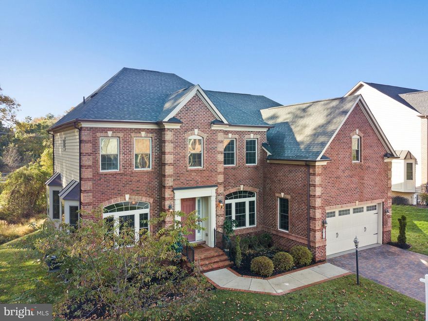 This is the one you have been waiting for!  5,600 + square foot home located in Howard County’s rarely available Wincopia Farms. Beautiful brick front estate built in 2015 offers 6 bedrooms and 5 and a half baths.  Luxury builder NVHomes Remington Place II model welcomes you home with a majestic 2 story foyer. Spacious elegance awaits in your formal living room with views of the adjoining forest conservation area. Entertain in style with a formal dining room featuring tray ceilings. The open concept gas powered kitchen is a gourmet’s delight. Dual ovens, walk-in pantry, stainless steel appliances, granite countertops and an oversized island where friends and family will want to congregate. A Butler’s Pantry adds additional storage and entertainment options. Sunlight through the windows of the massive, two-story Great Room calls to you to enjoy the moment and relax next to your gas fireplace. A main story bedroom with en suite bath could also be set up as an ideal home office. A mudroom with plenty of cabinets and counters off the 2 car garage is the perfect location for storing shoes and coats and other sundries.  Walk in laundry room with a sink and cabinets, half bath and additional storage closet complete the main level. Your dual staircase transports you to the living quarters. The second story includes 2 bedrooms that share a Jack and Jill bathroom, an additional bedroom with its own en suite bathroom and the incredible Primary Bedroom Suite. The Primary Suite features tray ceilings, a separate seating area and a covered balcony perfect for enjoying your coffee in the morning or cocktails at sunset. 2 separate walk in closets, jetted soaking tub, a large shower with two shower heads on opposite walls and 2 sinks complete this one of a kind Primary Suite. The walk-out basement awaits you with an additional gas fireplace, wet bar with dishwasher, refrigerator and additional cabinets and counters. There’s plenty of finished space to set up as a game room, exercise room, or a fun area for the family to relax together. The bedroom on the basement level comes complete with a spacious closet. A bonus room awaits your imagination. A full bath and separate unfinished storage area complete the basement level. 
Located minutes from shops and restaurants with convenient access to major commuting routes: 29/95/32/295/216 to get easily to Ft. Meade, Columbia, Baltimore & Washington DC