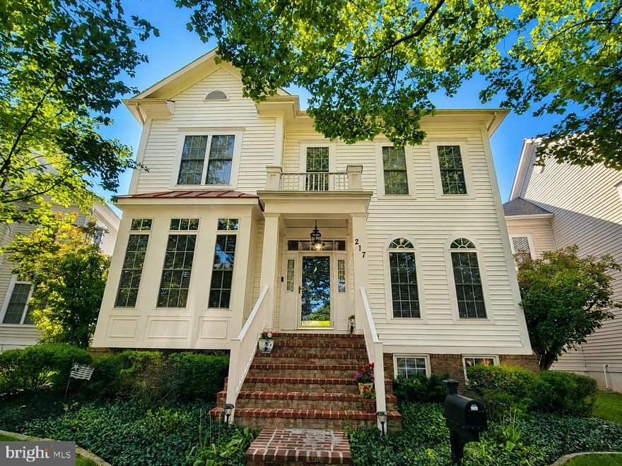 Built by renowned builder Mitchell & Best, this beautifully updated Bethesda II model is tucked along one of King Farm’s most scenic streets. Offering over 5,000 square feet of finished living space and one of the community’s largest floor plans, this exceptional residence impresses with elegant finishes, extensive updates, and an incredibly private backyard retreat.

Open the door to a grand foyer overlooking formal living and dining spaces accented by extensive crown molding, soaring ceilings, abundant natural light, and gleaming hardwood flooring throughout the home.

The beautifully renovated kitchen features quartz countertops, generous cabinetry, and an open layout ideal for both everyday living and entertaining. The adjoining family room with fireplace creates a warm and inviting gathering space.

Upstairs, the luxurious primary suite offers beautifully renovated spa-inspired baths and extraordinary custom-built walk-in closets that must be seen to be appreciated. Additional bedrooms provide spacious accommodations and flexible living options.

The fully finished lower level offers expansive recreation and multi-purpose living space ideal for guests, fitness, hobbies, media, or work-from-home needs, along with two large storage rooms providing exceptional flexibility and organization.

Step outside to your own private outdoor oasis featuring extensive hardscaping, a beautiful brick patio, hot tub, mature landscaping, and exceptional backyard privacy rarely found in the community.

Major updates include recently replaced HVAC systems, water heater, several replacement windows, renovated bathrooms, and extensive custom improvements throughout. Even the garage has been thoughtfully finished with drywall, paint, and custom shelving for added functionality and organization.

Located just steps from the community pool, clubhouse, fitness center, parks, walking trails, shopping, dining, and Shady Grove Metro, with easy access to I-270 and major commuter routes. King Farm is known for its vibrant community atmosphere, featuring neighborhood movie nights, concerts, seasonal festivals, and July 4th fireworks that make this community truly special year-round.

A rare opportunity to own one of King Farm’s most beautifully updated and expansive homes.