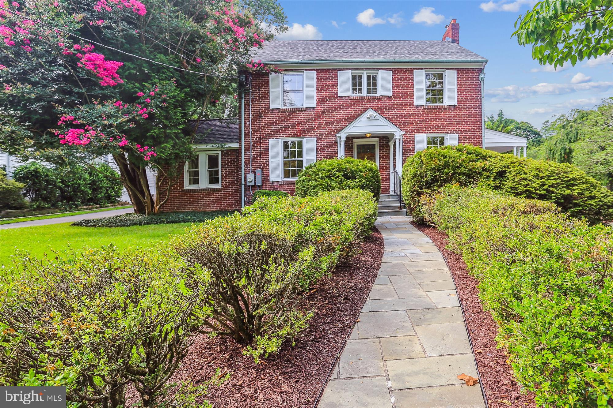 Welcome home to 1735 Overlook Drive, a 1937 expanded colonial in the sought after neighborhood of Old Hillandale. This 4 bedroom 3.5 bath timeless classic is situated on a beautifully landscaped and hardscaped half acre lot. The main level boasts gleaming hardwood floors throughout. The formal living room with custom built-ins is the perfect place to cozy up in front of the fireplace and has access to the inviting side porch. The large kitchen flows into the breakfast nook and first floor family room with an exposed brick wall and a bay window overlooking the patio and the expansive backyard. The formal dining room steps down into the slate floor den which could also be used as a home office. Completing the main level is a bedroom and full bathroom, that could be used as an in-law suite, and a spacious laundry room. The upper level is home to the primary suite with a private bathroom, 2 additional bedrooms, an additional full bath and walk-up attic that has been furnished with heat and a/c and could be finished off for additional living space. The lower level has a rec room with a second fireplace, a half bath, utility room with tons of storage and access to the garage. Recent improvements include 2025 – new HVAC, hardwood floors refinished, new paint throughout. 2023 – new roof. Convenient to 495, 95, University of Maryland, FDA, Hillandale Swim and Tennis Association,shopping (including the new Amazon Fresh) and restaurants.