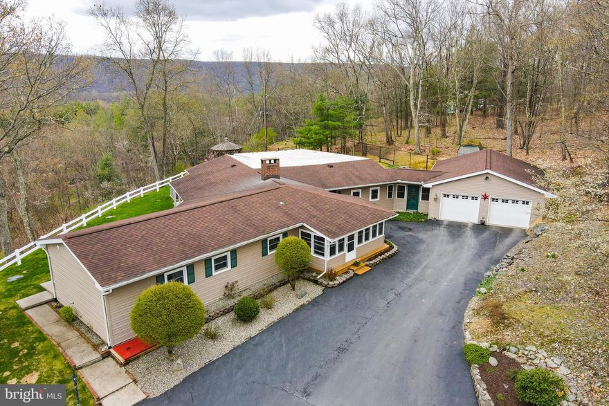 Must See!  This secluded, stunning, ranch home sits perched atop Mt. Nebo with breathtaking views of the Shawnee Valley. Only minutes from I-80 and downtown.  This 3 Bedroom 3.5 bath features almost 3200 Sq Ft of living space, hardwood floors, and each bedroom has it's own full bathroom.  This home was built to showcase the unobstructed miles of views from the family room, back deck, covered back porch and the gazebo.  Retreat to the back yard oasis and relax in the hot tub while enjoying the spectacular views.  This home also features an oversized two car garage and a fenced-in side yard.  Also, just a short drive to Shawnee Resort and Mountain. Owners will try and accommodate showings with less than 24 hours notice.