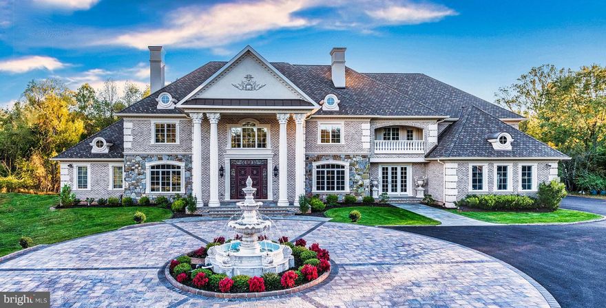 Once in a lifetime opportunity to own one of the finest estates in the greater Washington area. The magnificent Blue Ridge Manor is inspired by the finest European design and architecture, and offers unparalleled distinction and prominence. Discretely sited on a gated 5-acre lot in prestigious Great Falls, Virginia, this sublime 16,000 square foot resort-like estate offers exceptional luxury. 
Custom iron gates introduce a long-private driveway which leads to a private parking court and dramatic marble fountain. Stepping through the custom bronze doors, one is struck by both the grandeur of the home as well as the finest of details which are immediately evident. Hand-crafted plaster moldings, dazzling, custom made chandeliers and bespoke millwork reveal the unequivocal attention to detail this masterpiece holds. Over two years in the making, this sophisticated estate offers three kitchens, including a separate spice kitchen and large kitchen in the attached guest quarters, nine bedrooms, nine full baths and four half baths. The public rooms include an elegant formal living room and dining room, perfect for grand scale entertaining, as well as a stately library with coffered ceilings and custom bookcases. A true chef’s kitchen, complete with marble countertops and hand-crafted, custom cabinetry is handsomely complimented with a convenient breakfast area overlooking the serene, private backyard. The chef’s kitchen also opens to an inviting family room with soaring ceilings, a regal fireplace and French doors which lead to the outdoor stone balcony overlooking the exquisite setting and opulent pool. The main level also hosts a screening/media room, as well as an estate manager’s office with a separate entrance near the driveway for added convenience and privacy. 
Upstairs, the sumptuous private owner’s suite features a sitting room, an exquisite owner’s suite bath and separate dressing room, all designed to pamper every indulgence.
The bright, welcoming walk out lower level boasts a sprawling recreation room with a wine cellar and a fully appointed wet bar overlooking the uniquely private views of the backyard oasis. The list of luxurious amenities continues with a private spa complete with a sauna, fitness studio and massage room, as well as a gift-wrapping room. A separate, two level, two-bedroom guest quarters is located in an adjoining wing of the estate to provide added privacy. When you step outside this grand estate, you enter a world of your own. The beautiful grounds, both lush and private, are the perfect backdrop to this peaceful retreat. Amid the gardens and towering trees is an expansive space for entertaining, with a glittering pool with laser jet fountains, a waterfall and mesmerizing fire bowls, as well as a private putting green. 
Blue Ridge Manor is in a location that is convenient to the entire Washington area. Located just outside of Washington, DC and merely 10 minutes from the dynamic urban hub of Tysons Corner, 5 minutes to downtown Reston, and 15 minutes to Dulles airport. Blue Ridge Manor is truly a one-of-a-kind estate of global significance and one that cannot be duplicated. 
Shown by appointment. 
CHECK OUT THE 3D Matterport Tour & YouTube Video!