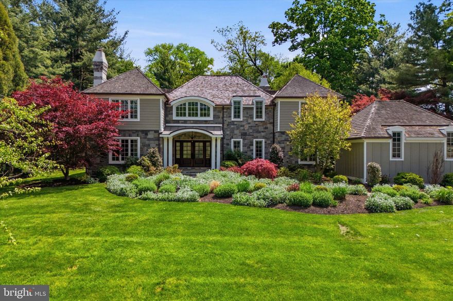 Tucked away on a quiet, tree-lined street in one of the Main Line's most coveted neighborhoods, 509 Northfield Road is a rare offering that blends traditional architecture with thoughtful modern updates. From the moment you arrive, the home's stately curb appeal — stone façade, cedar roof, manicured landscaping, flagstone walkway, and gracious entry — sets the tone for what lies within, nearly 4800 square feet across 3 floors of beautifully appointed living space.

The exterior front elevation has been completely transformed by Rene Hoffman and McDermott Construction. Stucco no more, but a reimagined facade featuring a new porch, threshold and wooden French doors, beautiful stonework, and HardiBoard siding. A new flagstone curved walkway is adorned with new landscaping by Naturescapes.

Step inside to discover a sun-filled 2-story foyer with a grand staircase, gorgeous living room, and spacious dining room, all inviting you into a functional layout designed for both family comfort and entertaining.

The bright kitchen, fitted with granite countertops and SubZero and Thermador appliances and attached breakfast room flow effortlessly into the great family room with its stone-faced fireplace and large picture windows, skylights, and patio doors that showcase serene views of the backyard and pool. The main floor is complete with a laundry/mudroom and powder room AND a bonus flex room providing space for crafts or teenage hangouts.

Head back in the foyer and up the staircase where natural light abounds. The primary suite with full walk in closet offers a private retreat with a spa-inspired ensuite bath featuring a soaking tub and double vanity. At the end of the balcony/hall are three additional sizable bedrooms and a hall bathroom which provide comfort and flexibility for family and guests.

The lower level, designed by Ann Decker Design and constructed by Buck Ridge, now has easy stairway access to the patio and pool. Once a raw, unfinished basement, is now a full entertaining space with a wet bar complete with gorgeous Onyx countertops, Cafe appliances, and custom built cabinetry. Don’t miss the quiet office, dedicated gym space, full glass shower bath with heated floors, 2nd laundry and a Sonos system wired throughout.

Outside, an expansive backyard retreat complete with a stunning in-ground pool and flagstone patio, overlooks a lush, landscaped yard enclosed by estate fencing. Whether it’s summer barbecues or quiet mornings with coffee, this is the spot to relax and unwind.

Additional amenities include a whole house generator, 4 zoned HVAC and 2 mini splits in the lower level, 3 fireplaces (gas, wood, electric), new garage doors.

The property’s prime location means you’re just minutes away from top-rated Tredyffrin-Easttown School District, private schools, boutique shopping, premier dining establishments, and the Devon or Paoli train station for easy commuting.
Don’t miss the chance to make this stunning Devon home your own—schedule your private tour today!