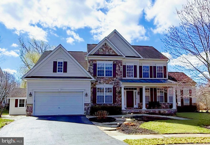 Nestled in the serene Presidential Estates, this charming Colonial home offers a perfect blend of comfort and elegance. Built in 2004, the property boasts a well-maintained exterior featuring stunning stone accents and extensive hardscaping, creating a warm and inviting curb appeal. Step inside to discover a spacious interior adorned with rich hardwood floors and plush carpeting. The open floor plan seamlessly connects the family room, complete with a cozy gas fireplace, to the eat-in kitchen, perfect for gatherings. The kitchen is a chef's dream, featuring upgraded countertops, stainless steel appliances, and an island for additional prep space. With five generous bedrooms and four and a half bathrooms, including a luxurious primary suite with a soaking tub and walk-in shower, this home caters to all your needs. Enjoy the convenience of a main floor laundry and a central vacuum system, making daily chores a breeze. The outdoor space is equally impressive, featuring a private, fenced-in heated saltwater pool, perfect for summer relaxation. The beautifully landscaped yard backs to trees, providing a tranquil retreat, while the patio and terrace offer ideal spots for entertaining or enjoying quiet evenings. Additional highlights include a partially finished basement with a walkout entrance, an attached two-car garage, and a security system for peace of mind. This home is not just a property; it’s a sanctuary waiting for you to create lasting memories.