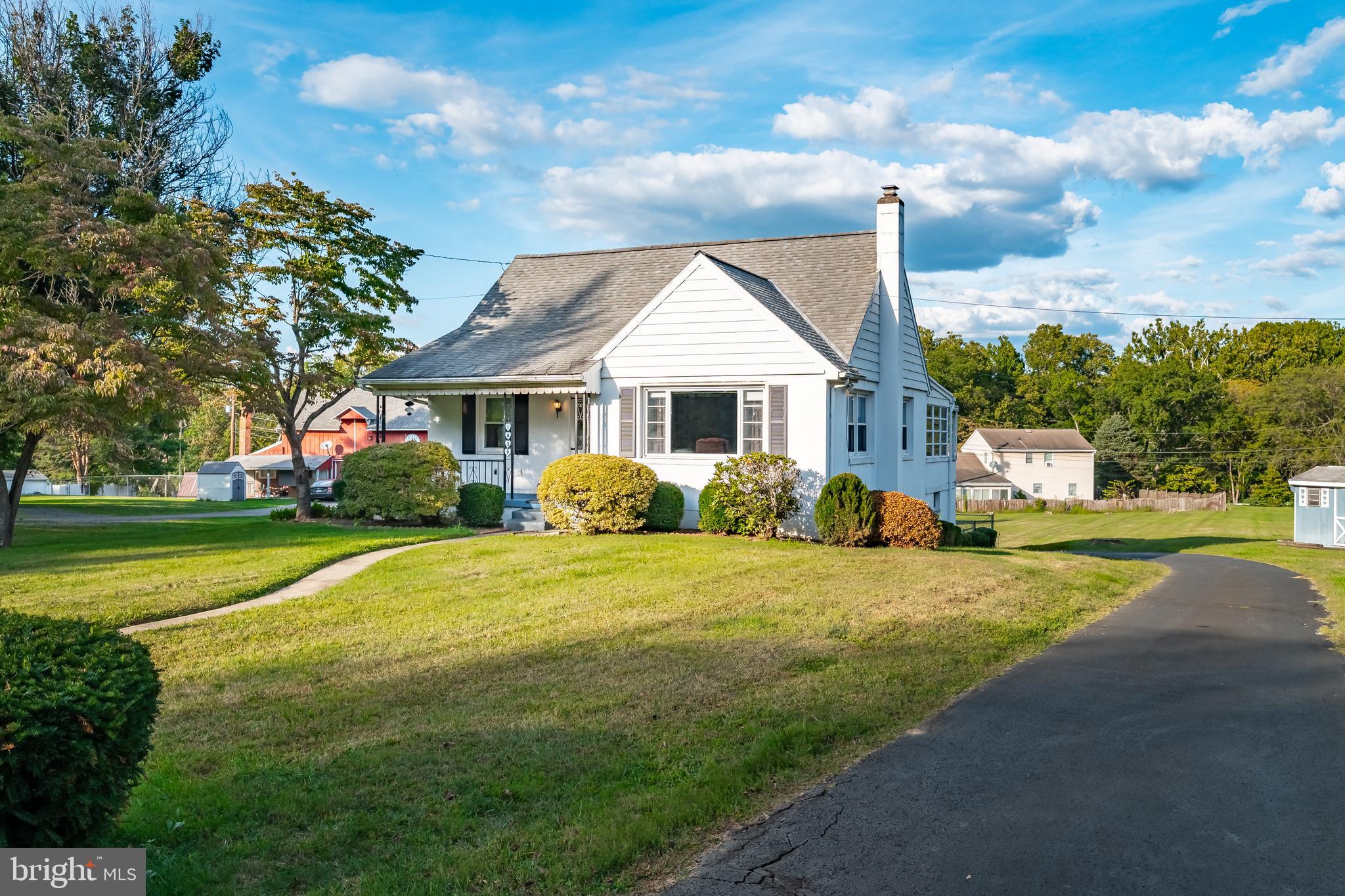 MULTIPLE OFFERS RECEIVED. HIGHEST & BEST DUE FRIDAY 9/12 BY 1PM. Now available in Parkland School District - this well maintained South Whitehall Township Cape Cod is set on nearly an acre and offers 4 bedrooms, 3 baths, and over 1,800 sq feet of finished living space. The first floor features a spacious living room with a large picture window and an eat-in kitchen with vintage Republic Steel fixtures in excellent condition and a bright dining area. 2 bedrooms each with original hardwood floors, a full bathroom with vintage console sink and full tub and shower with tile surround, and a 3-season sunroom off the kitchen complete this level. Upstairs you’ll find 2 additional bedrooms with built-in drawers, original hardwood floors and a half bath. The partially finished lower level includes a recreation room with garage access, laundry room, ample storage space and an additional half bath for added convenience. The exterior of this stunning property features nearly an acre of land to enjoy, includes a covered porch, back patio to step out on, and utility shed for lawn equipment storage. The home's built-in garage and ample driveway parking also add convenience. This home provides a rare combination of space, character, and a large lot in a much loved location close to shopping, schools, parks, restaurants, and all major roadways.