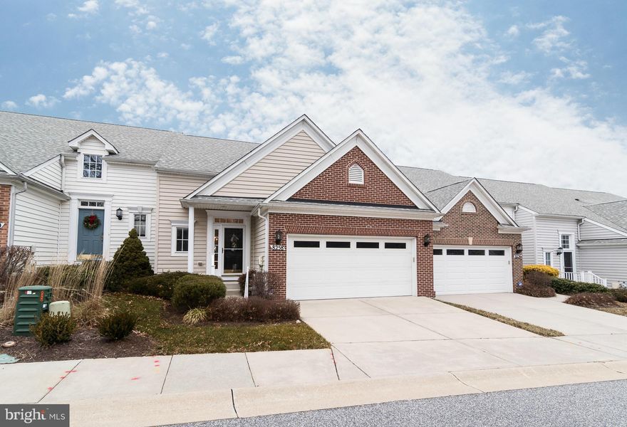 Stunning 2-car garage 55+ villa! Endless upgrades: 9' ceilings; gleaming hardwoods; eat-in kitchen w/42" maple cabinets, SS appliances & tile backsplash; sunroom w/cathedral ceilings; 1st floor MBR w/luxury MBA; finished walk-out LL w/4th bdrm & 3rd full bath; rear deck!