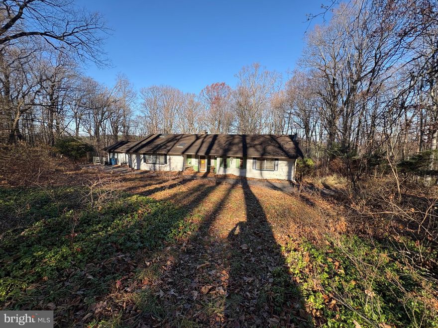 This home is being sold in as is condition. A total restoration is needed. Features  a beautiful wooded lot at that adjoins several large properties.  Situated at the end of a cul de sac, and featuring a circle driveway with a large paved parking area that's ideal for for multiple vehicle parking. The home features a large living room with abundant windows overlooking the woods Kitchen with eating area, dining room, and screened porch off of the kitchen. Close to schools, the Farm park, and the Horseshoe trail.